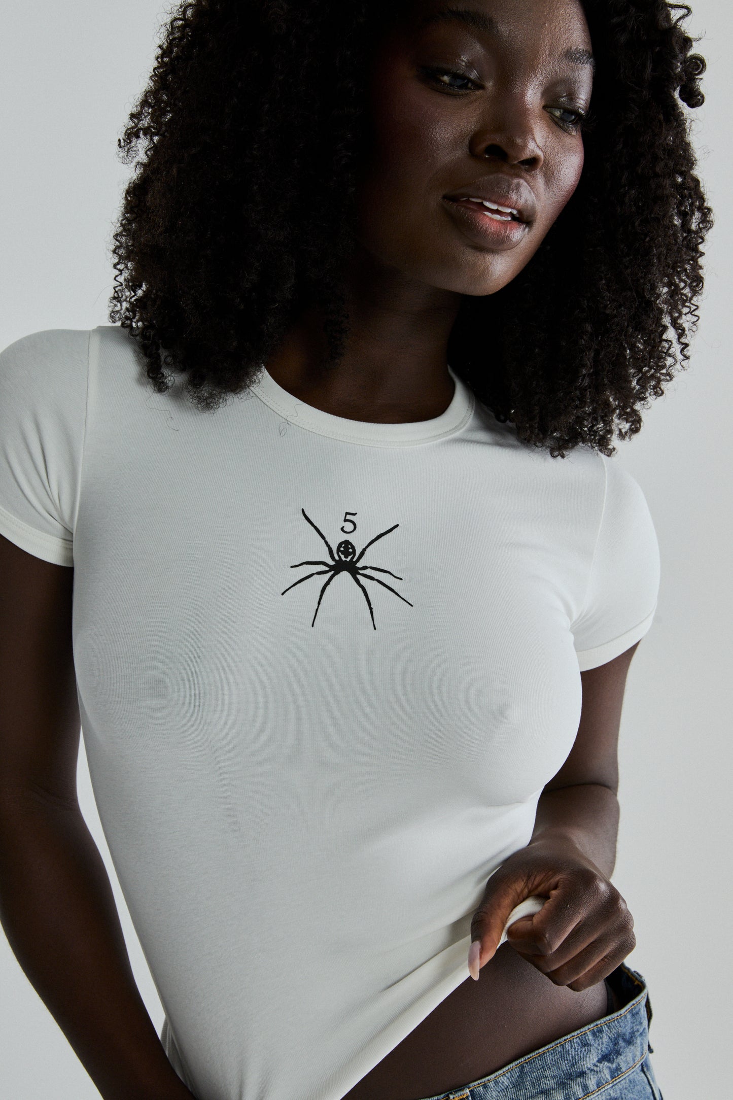 WHITE TM BABY TEE ON MODEL