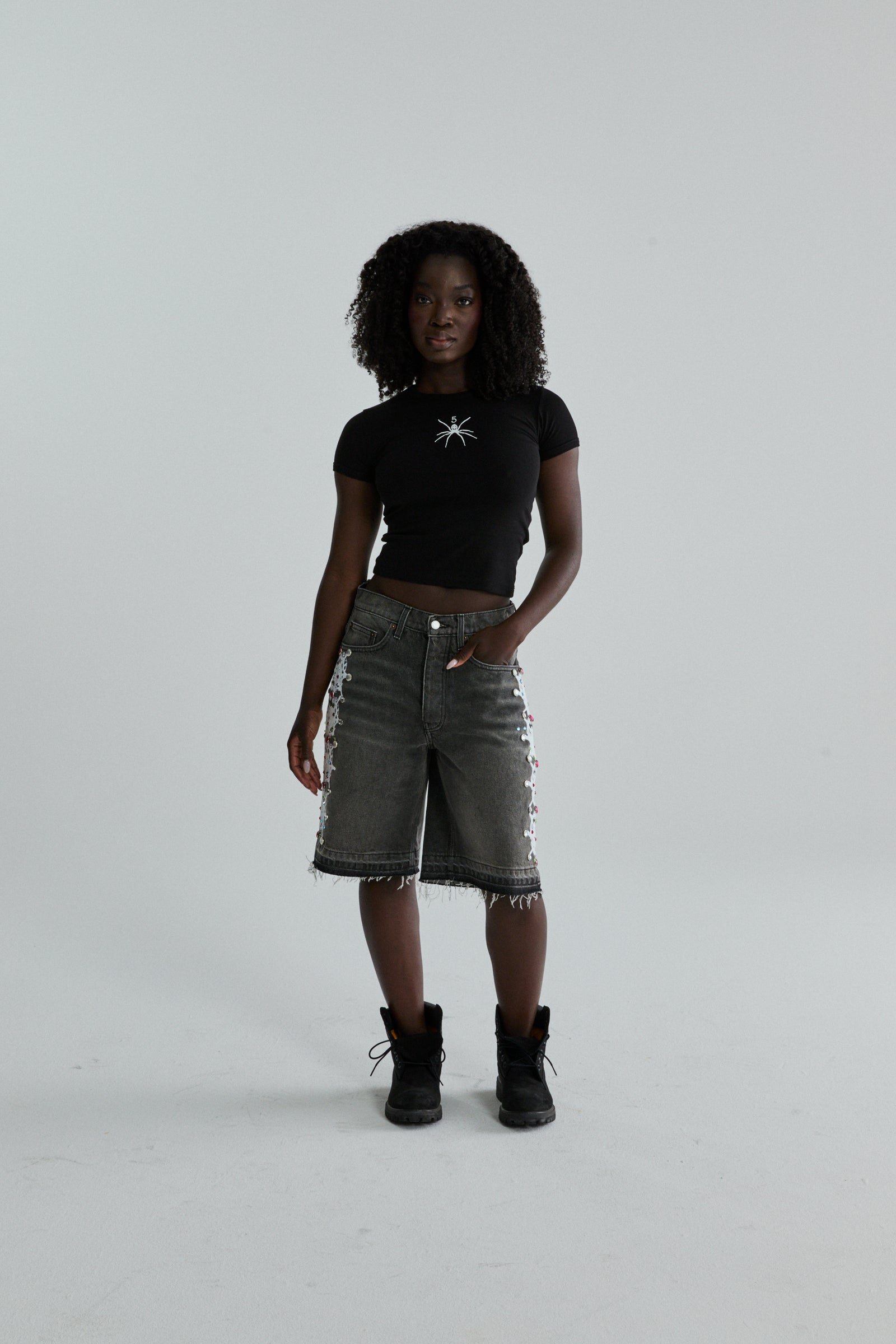 BLACK TM BABY TEE ON MODEL