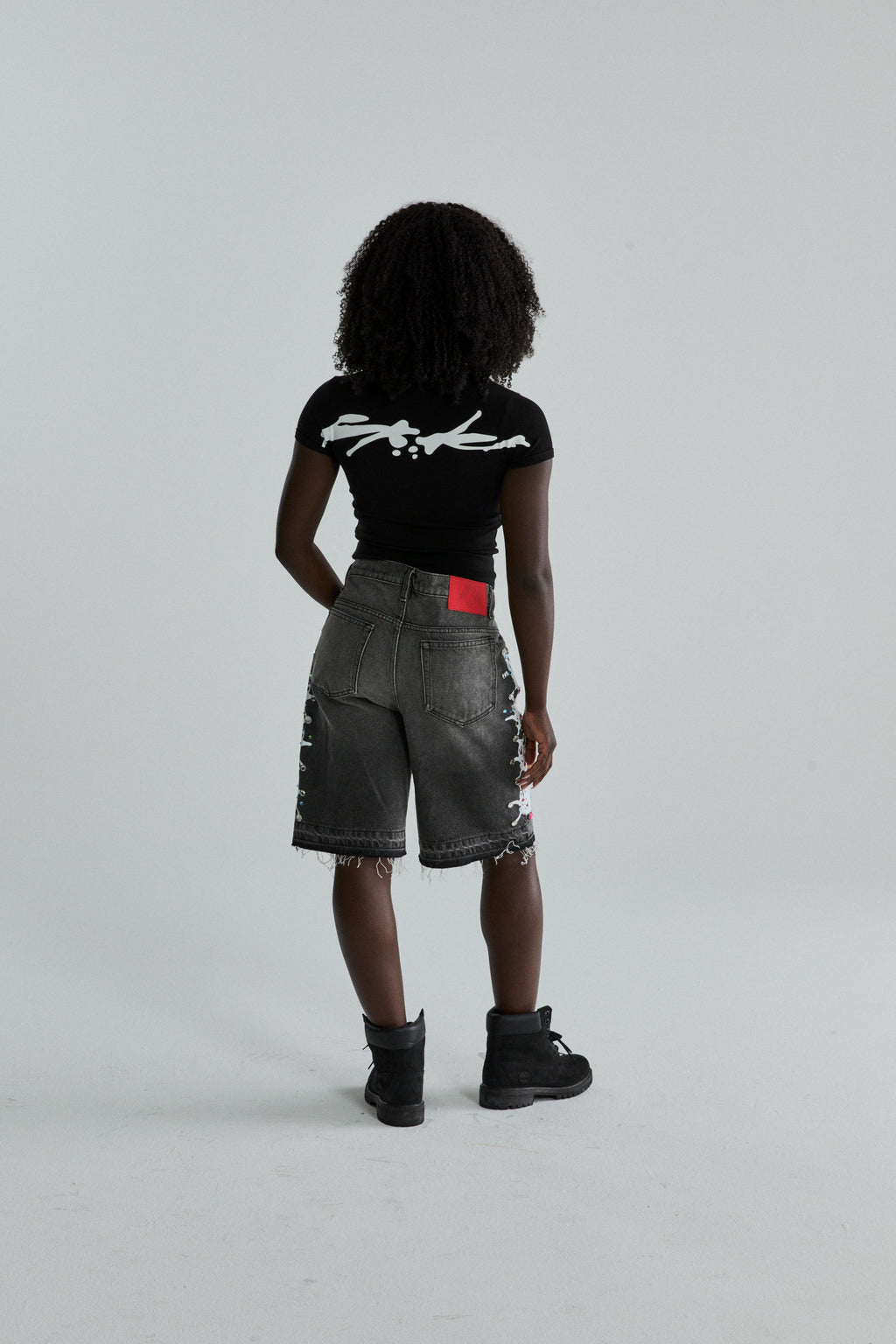 BLACK TM BABY TEE ON MODEL