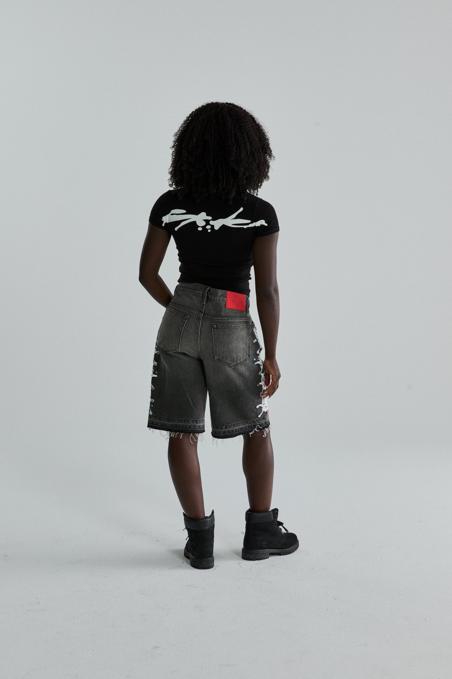 BLACK TM BABY TEE ON MODEL