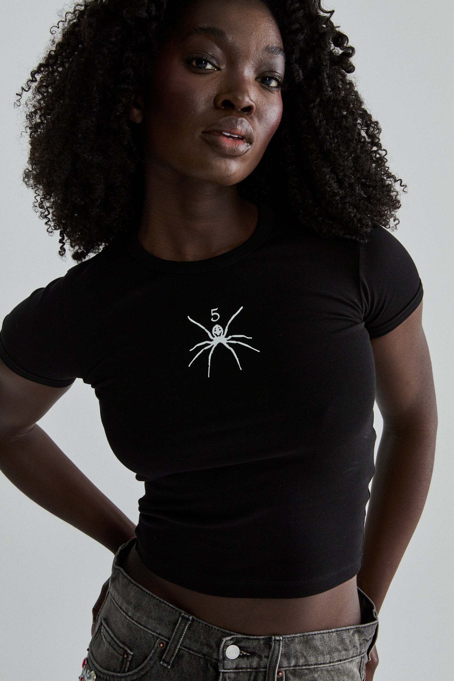 BLACK TM BABY TEE ON MODEL