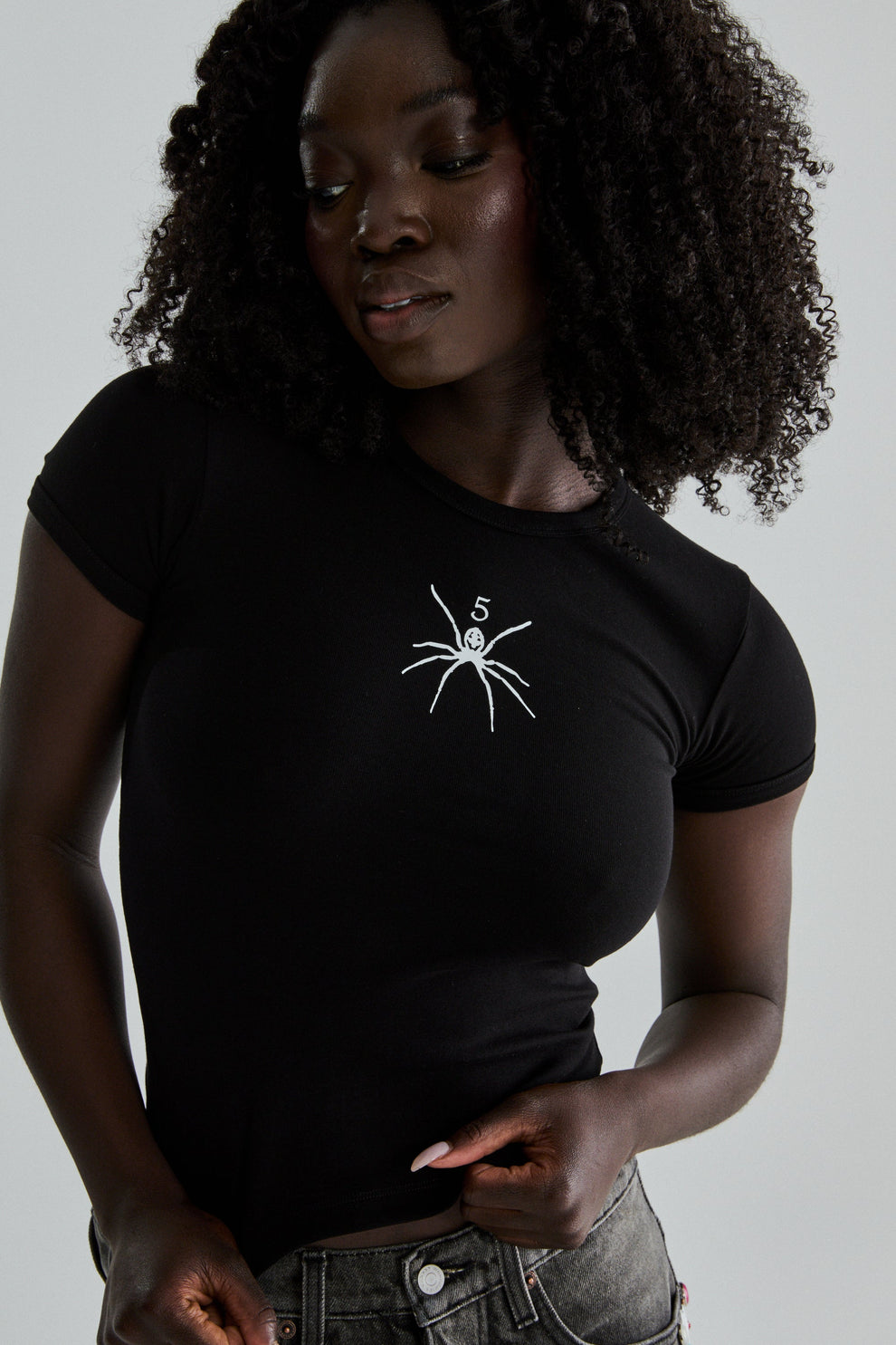 BLACK TM BABY TEE ON MODEL
