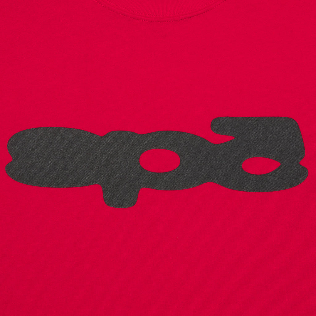 Bright red 100% cotton tee featuring a black bubble-style graphic print on the front in a standard fit.