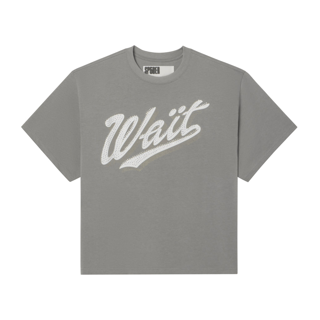 Grey 100% cotton t-shirt with a white cursive Wait graphic print and sparkling rhinestone detailing on the front.