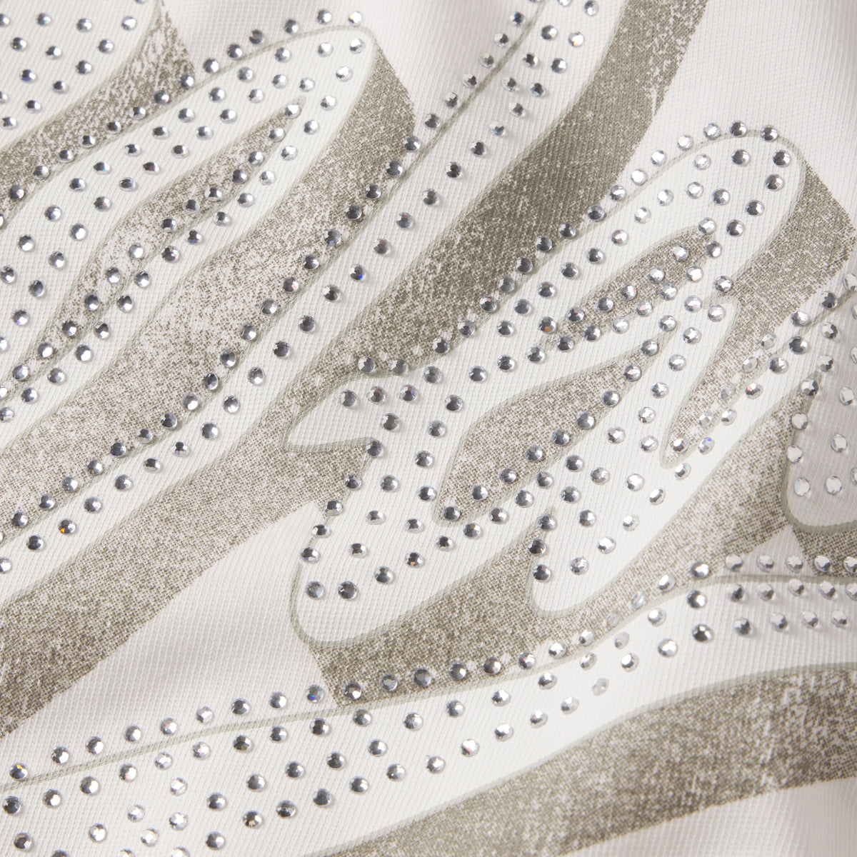 White cotton tee featuring a grey graphic print design embellished with sparkling rhinestone details.