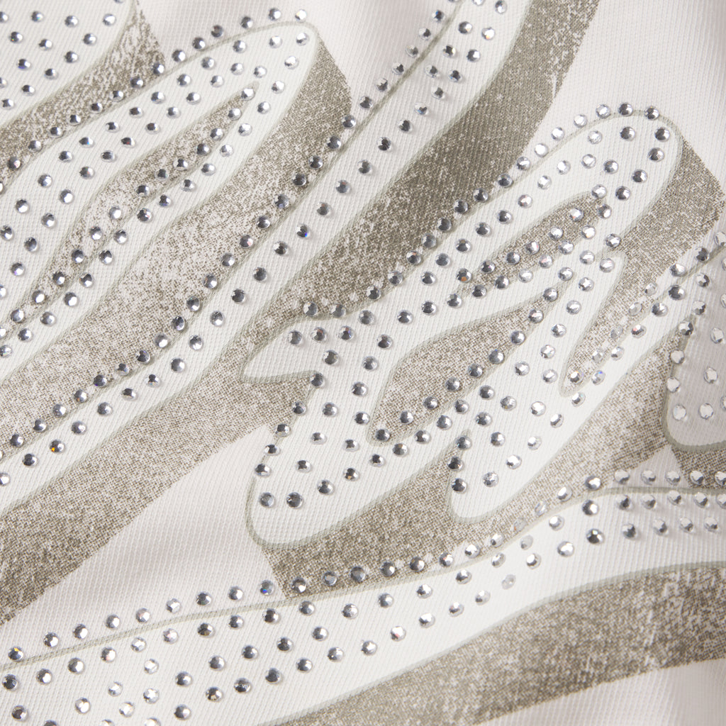White cotton tee featuring a grey graphic print design embellished with sparkling rhinestone details.
