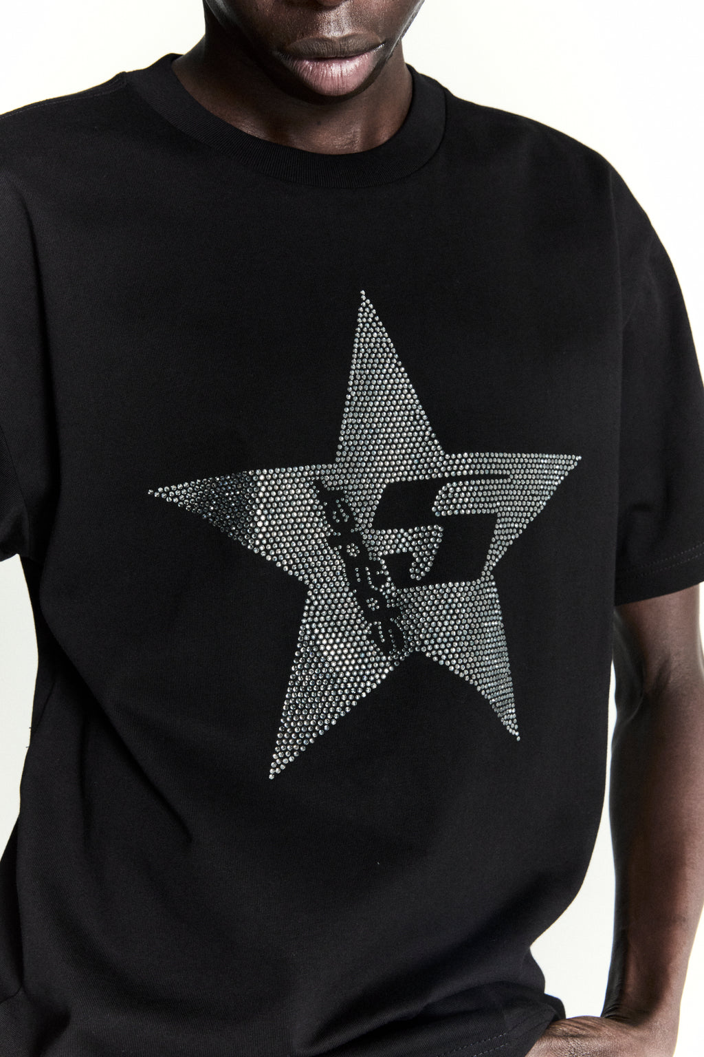 Black 100% cotton tee with a large rhinestone-embellished 5-star design.