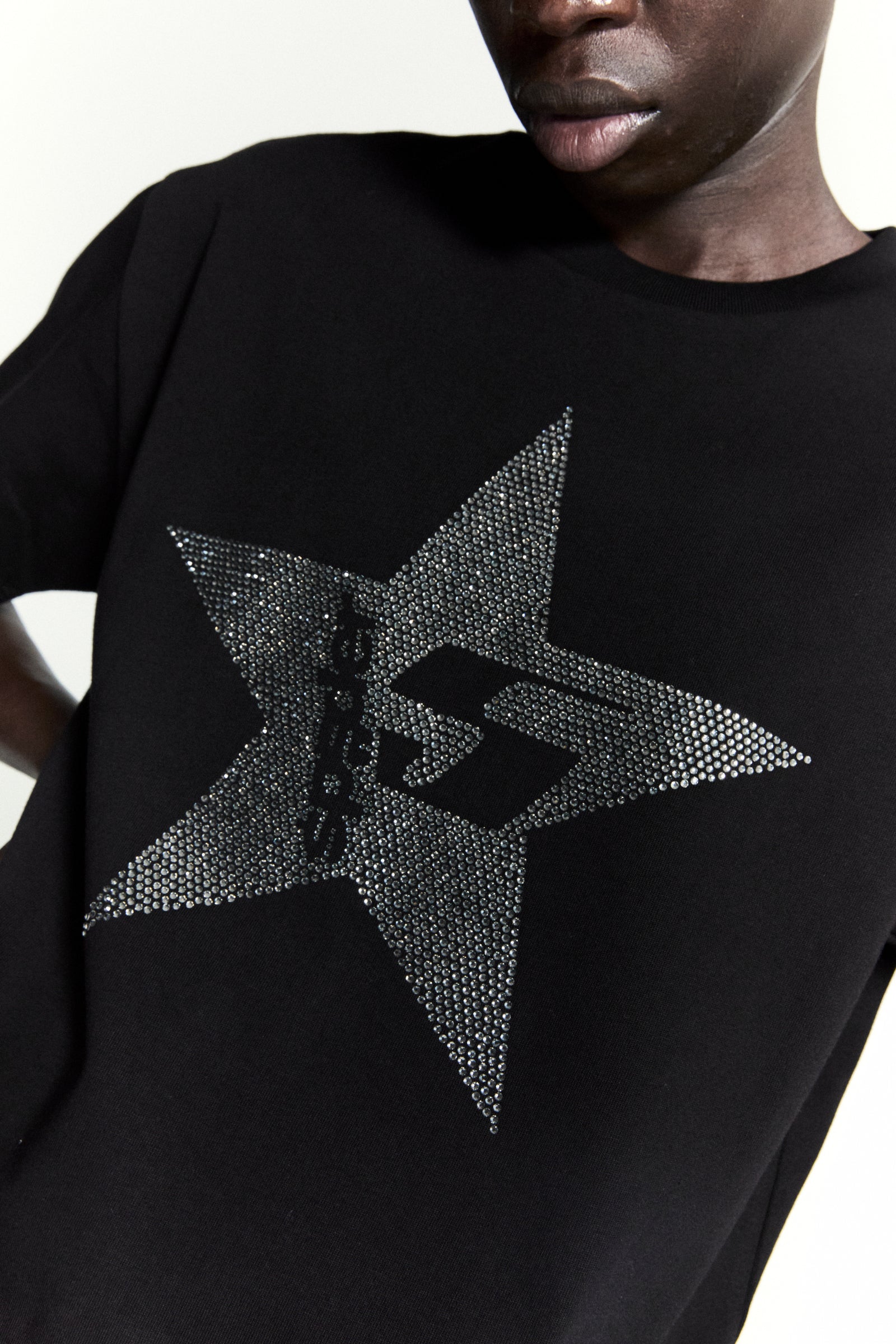 Black 100% cotton tee with a large, sparkly rhinestone 5-star design.
