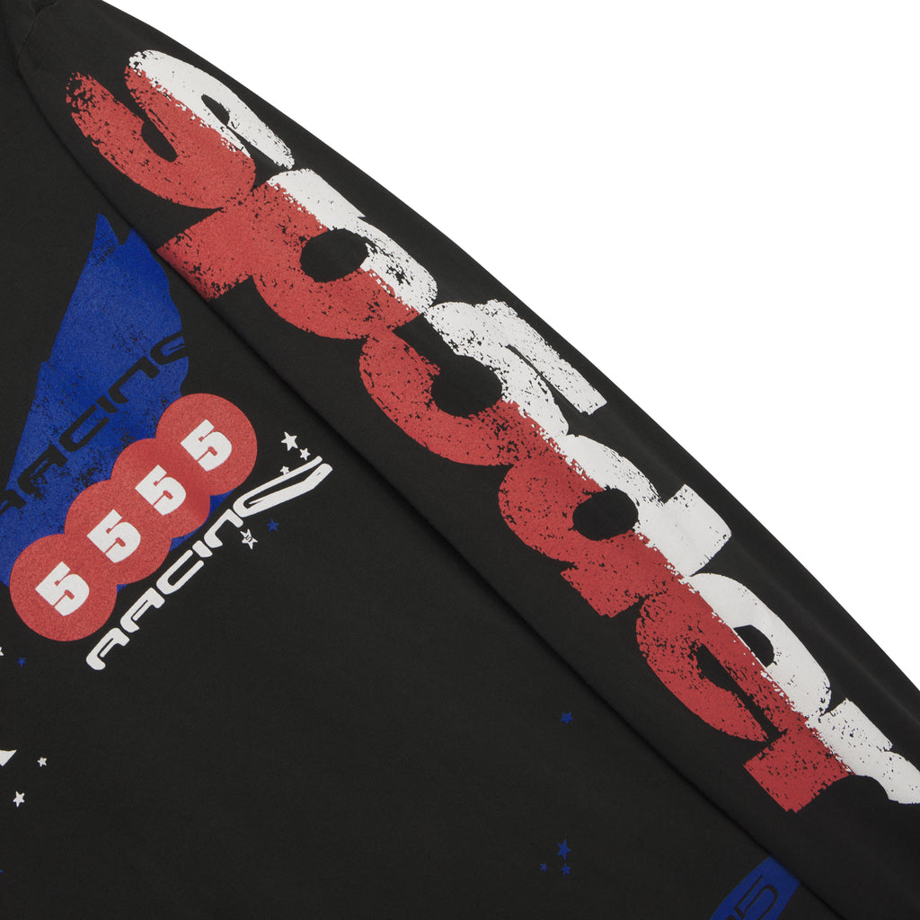 Black 100% cotton long sleeve tee with red, white, and blue racing graphic print on sleeves.