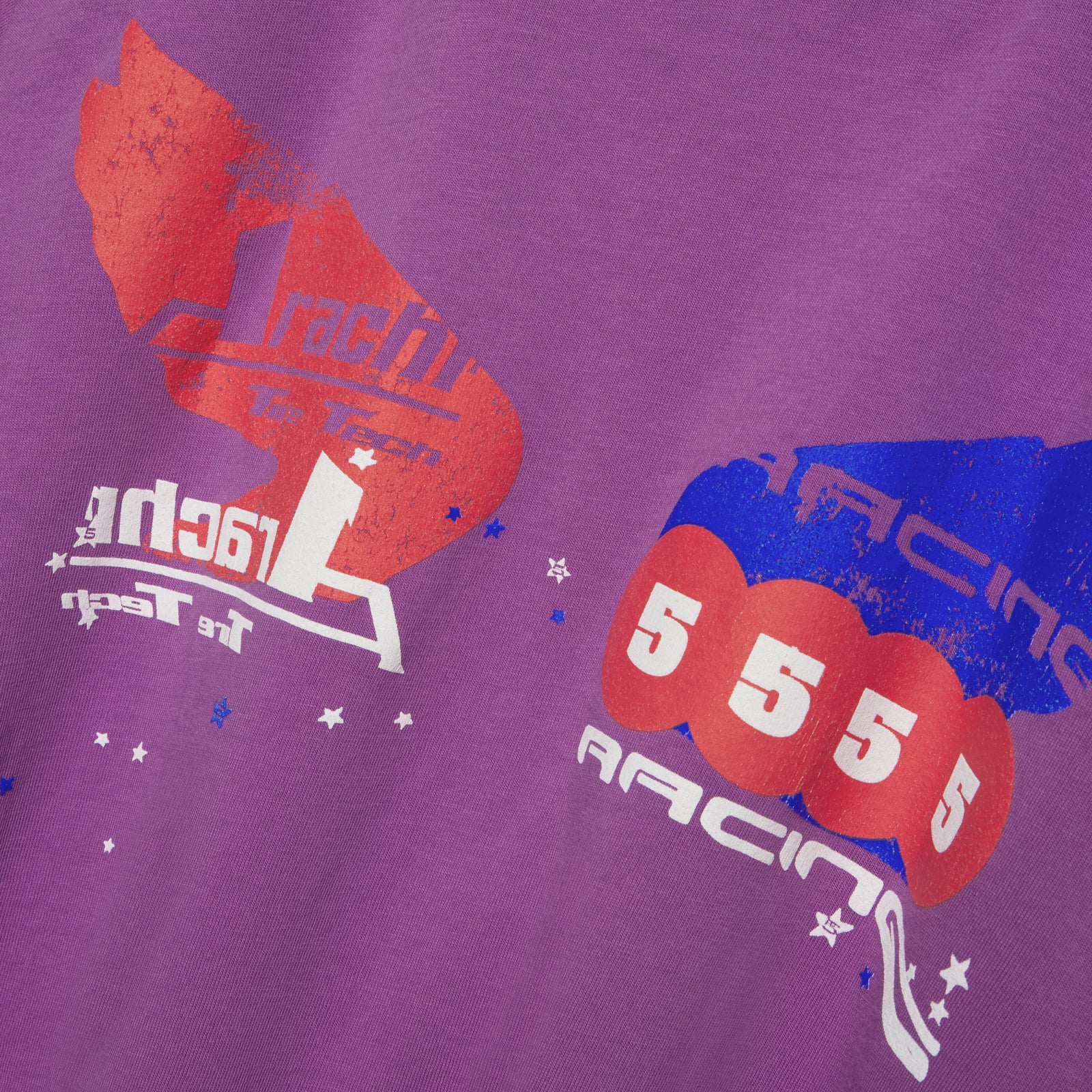 Purple 100% cotton long sleeve tee with red and blue graphic print, "RACING" text, and stars.