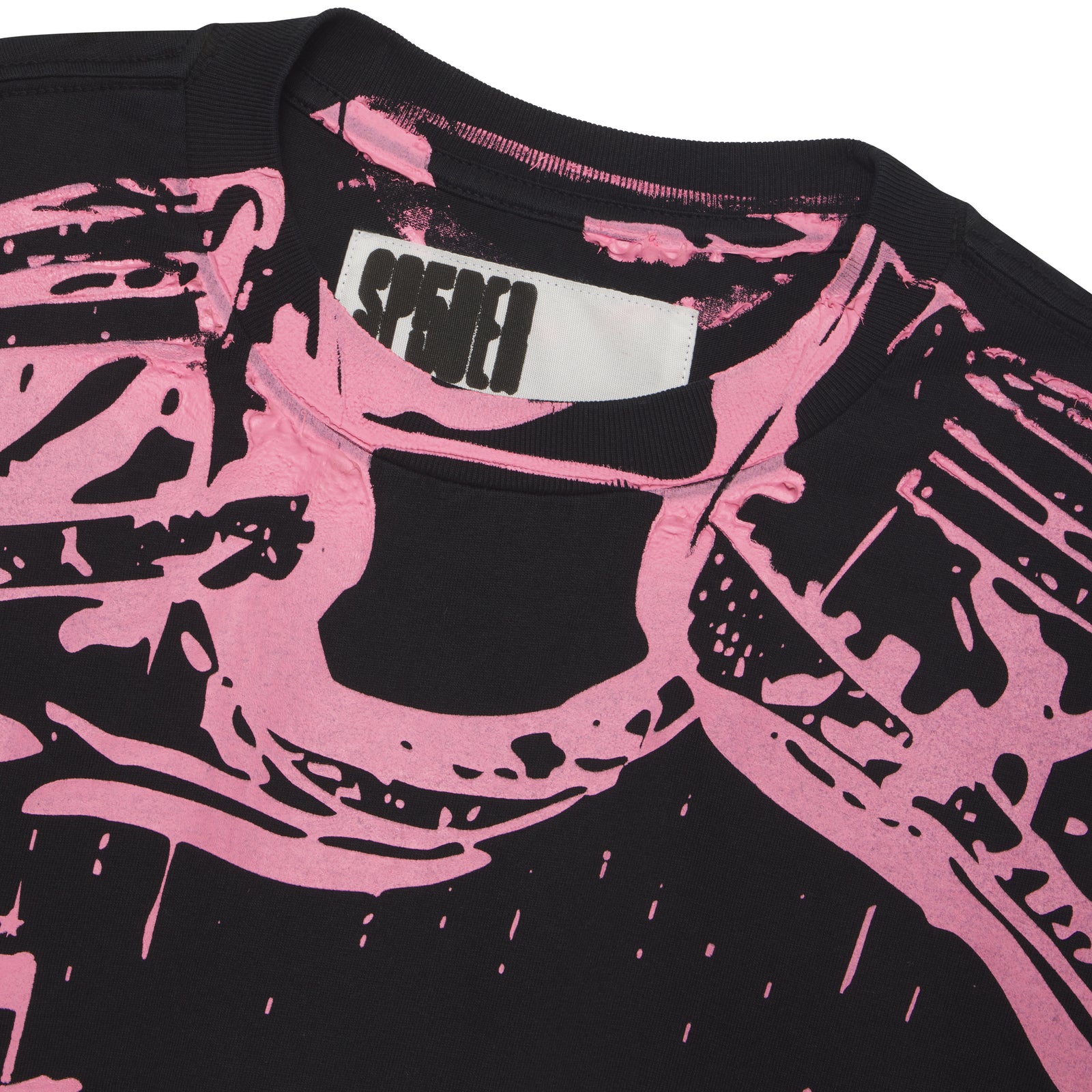Black 100% cotton tee with a pink trompe l'œil graphic print on the front.