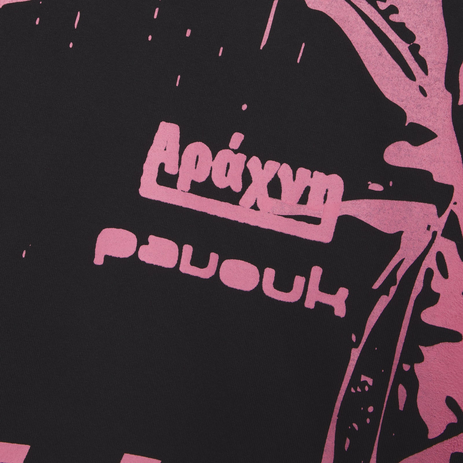 Black 100% cotton JERSEY OVERPRINT TEE with pink graphic print and "Apaxym" text.