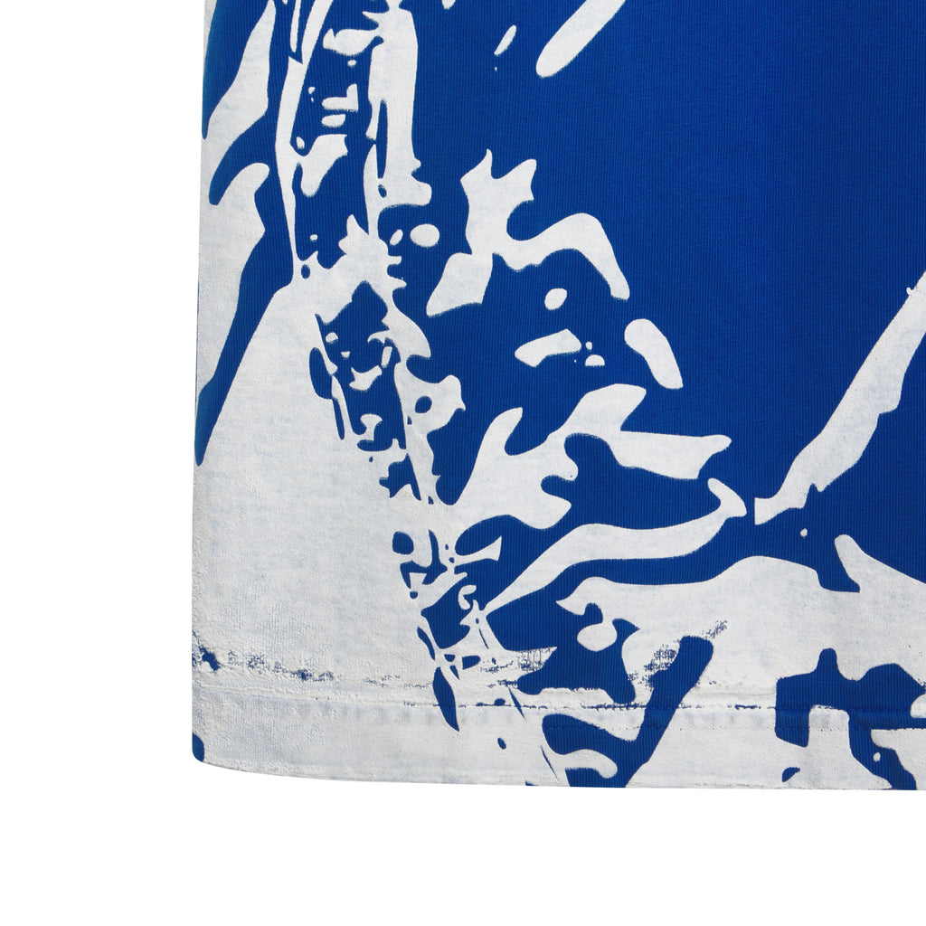 Blue 100% cotton tee with white abstract graphic print.