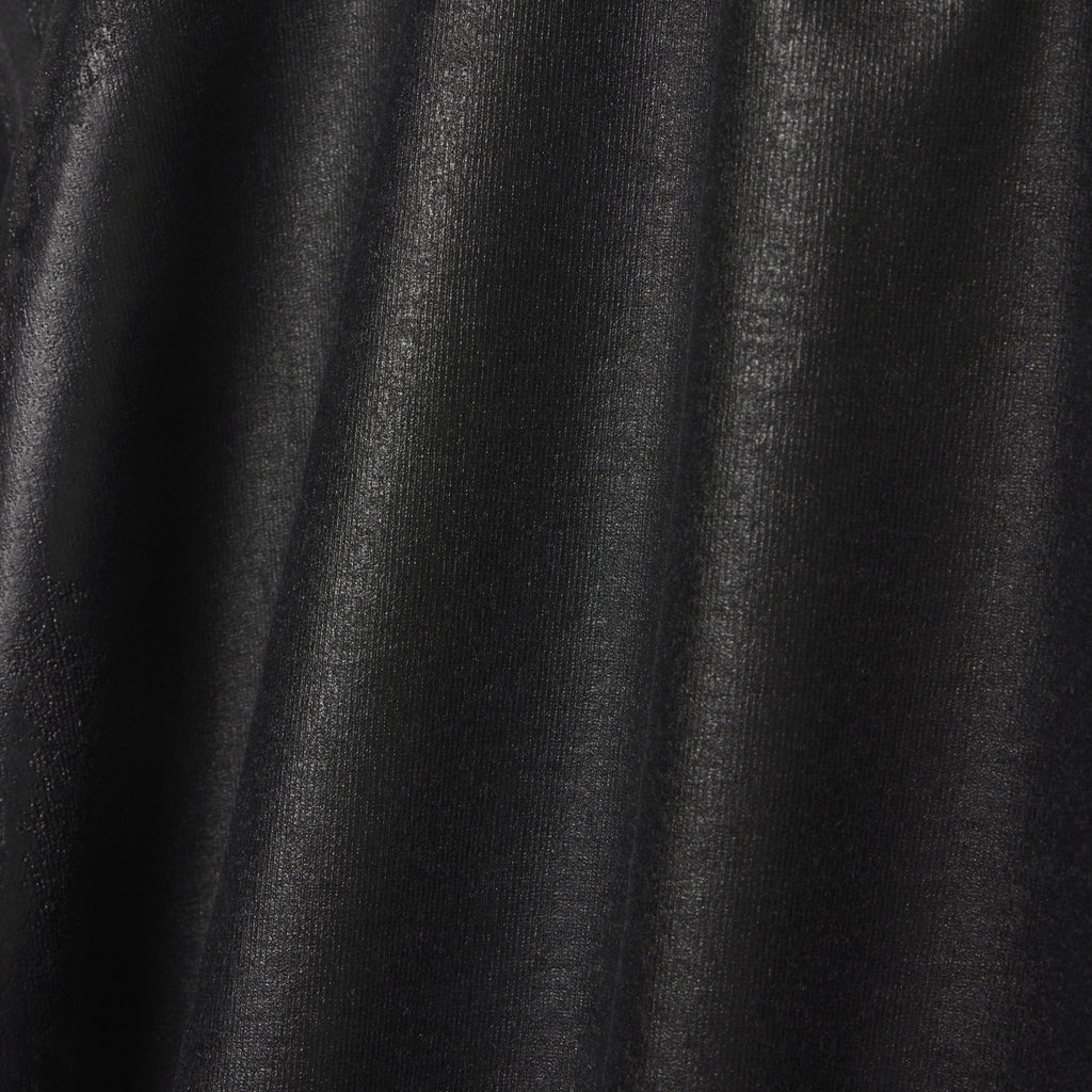 Close-up of black 100% cotton OVERPRINT ARAIGNEE TEE with subtle texture and folds.
