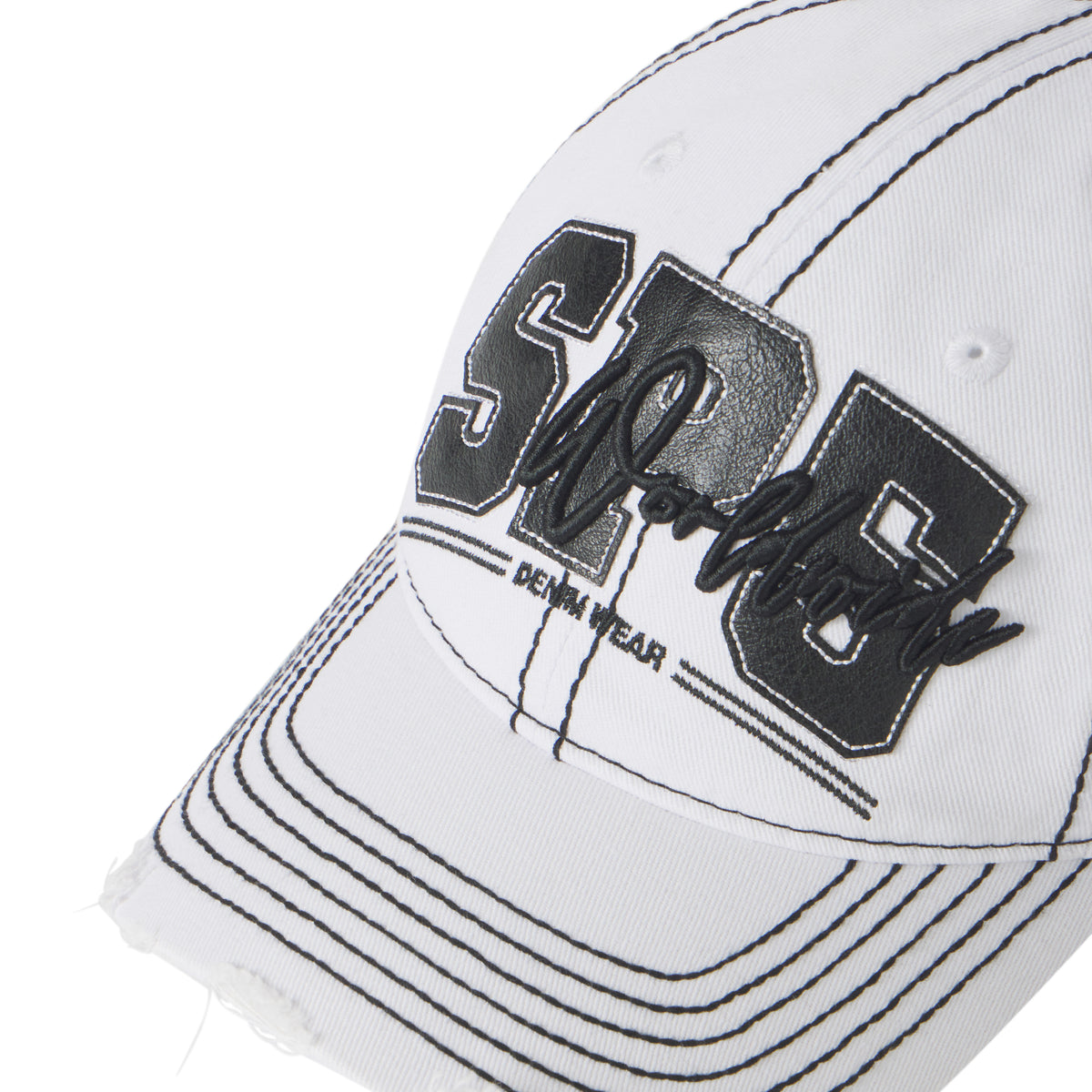 White baseball cap with black contrast stitching, distressed brim, and layered SP5 graphic logo appliqué.