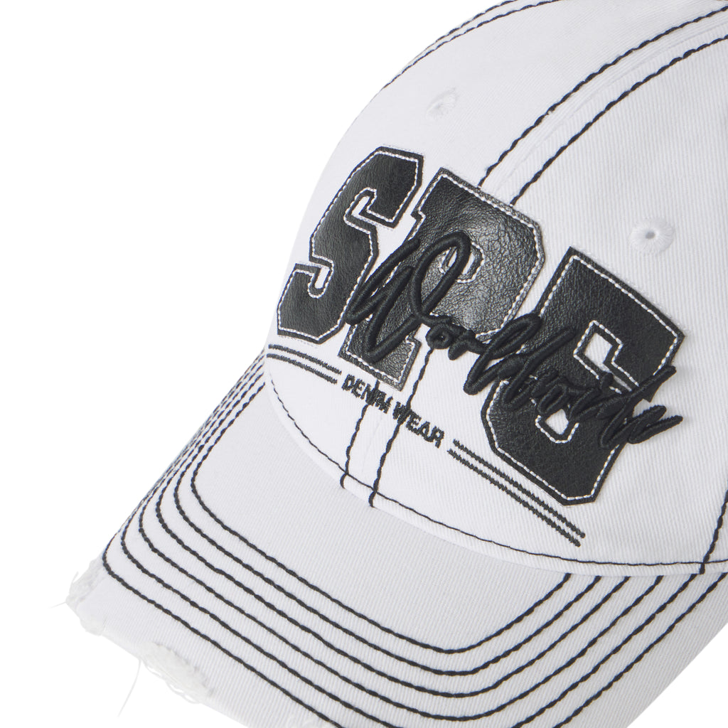 White baseball cap with black contrast stitching, distressed brim, and layered SP5 graphic logo appliqué.