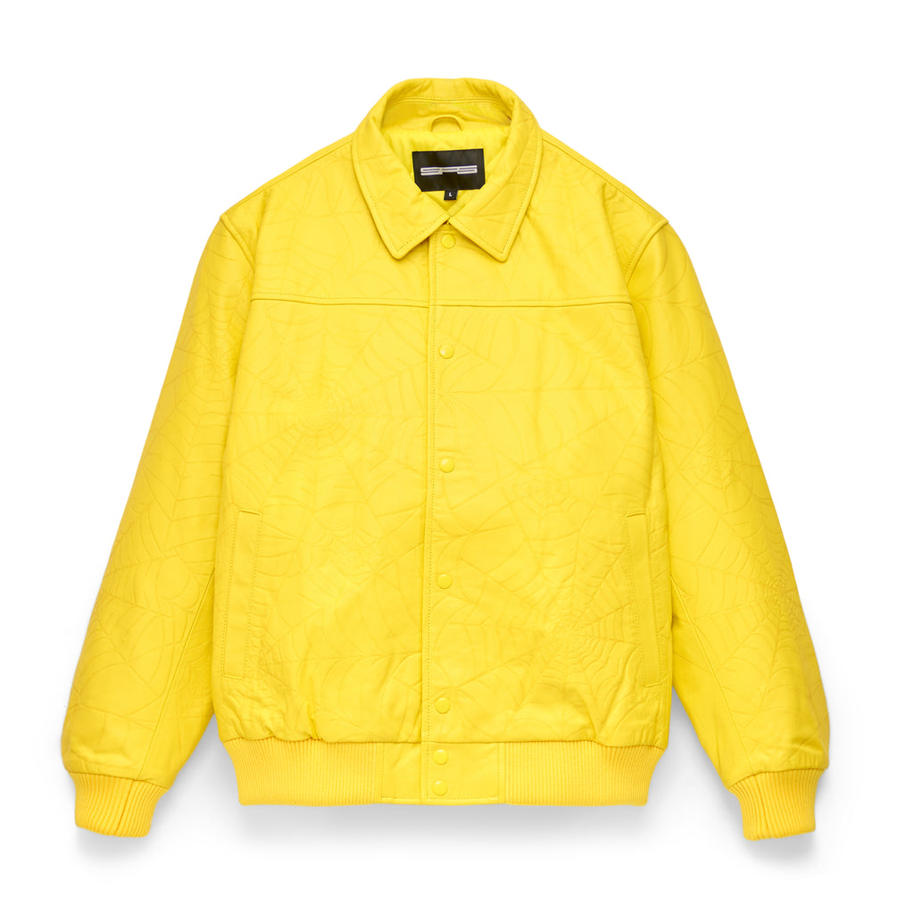 Yellow cowskin leather jacket with debossed web design, spread collar, and press-stud closure.
