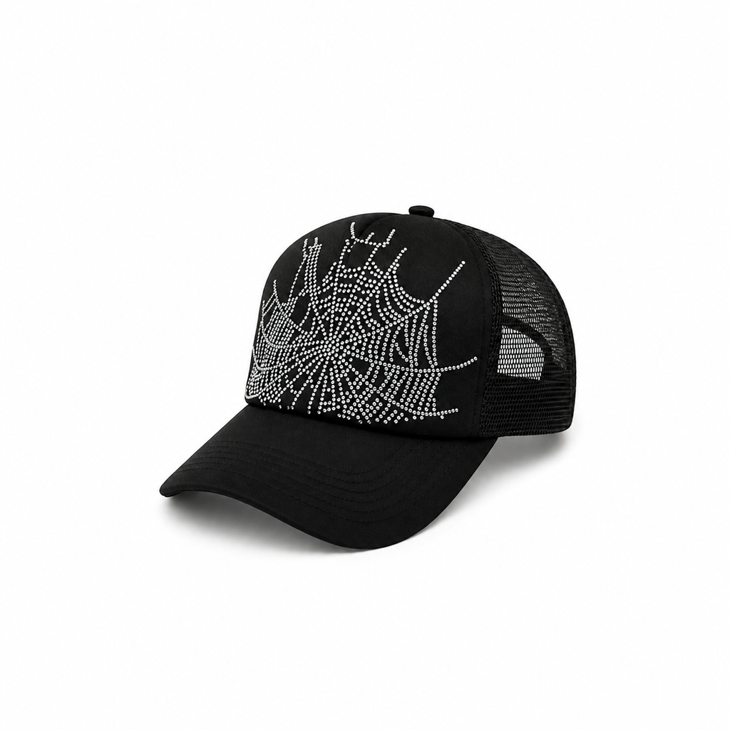 Black trucker hat featuring a sparkling rhinestone spider web graphic design, curved brim, and adjustable snapback closure.