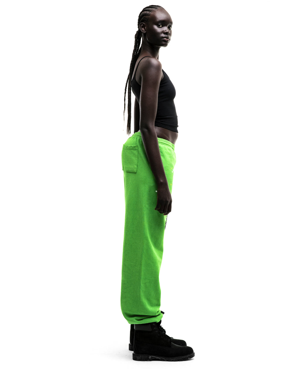 Model in bright green RHINESTONE PUNK V2 SWEATPANT with puff print, rhinestones, and elasticized cuffs.