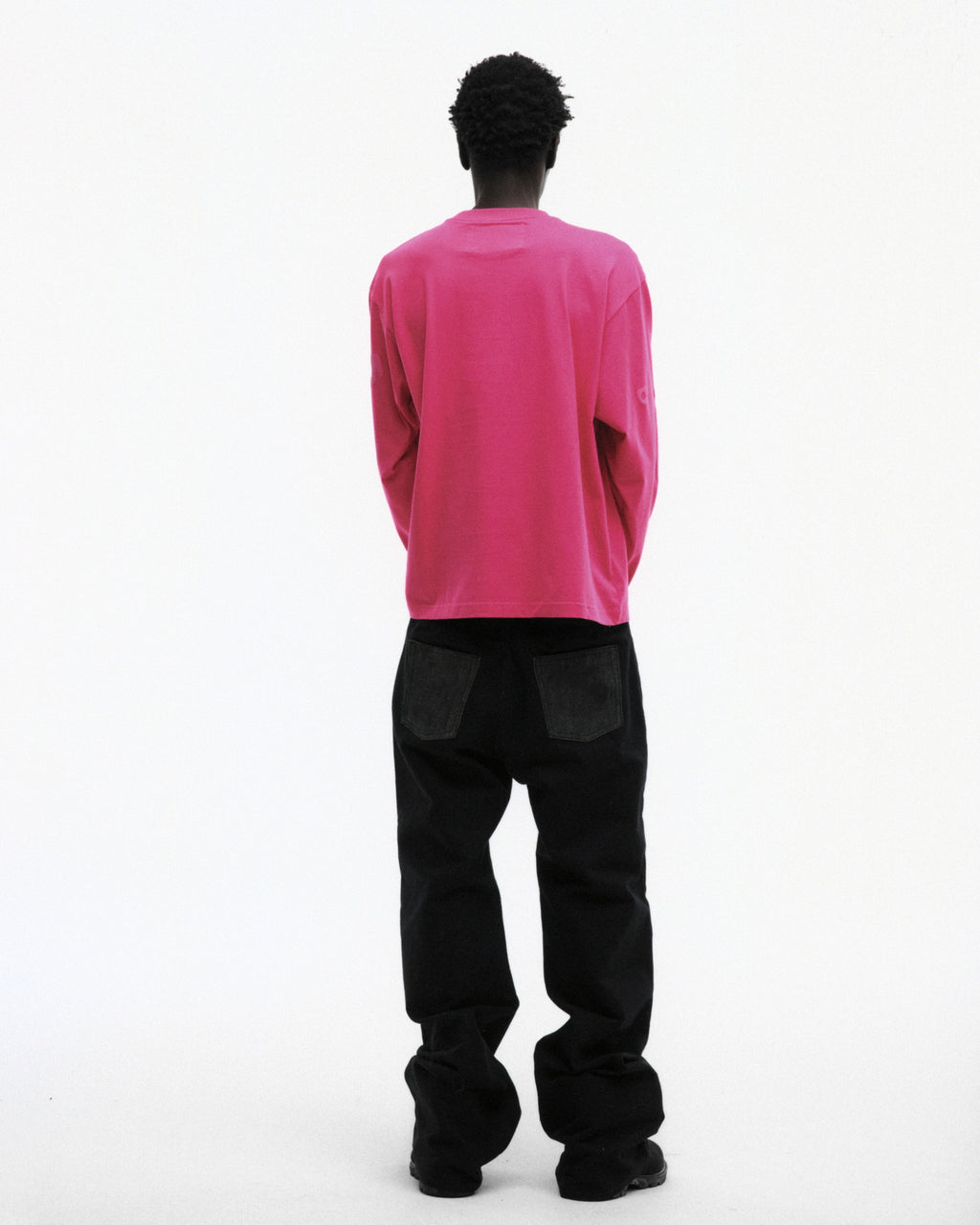 BELUGA LONGSLEEVE: Pink heavyweight 100% cotton tee with puff/discharge print, worn with black pants.
