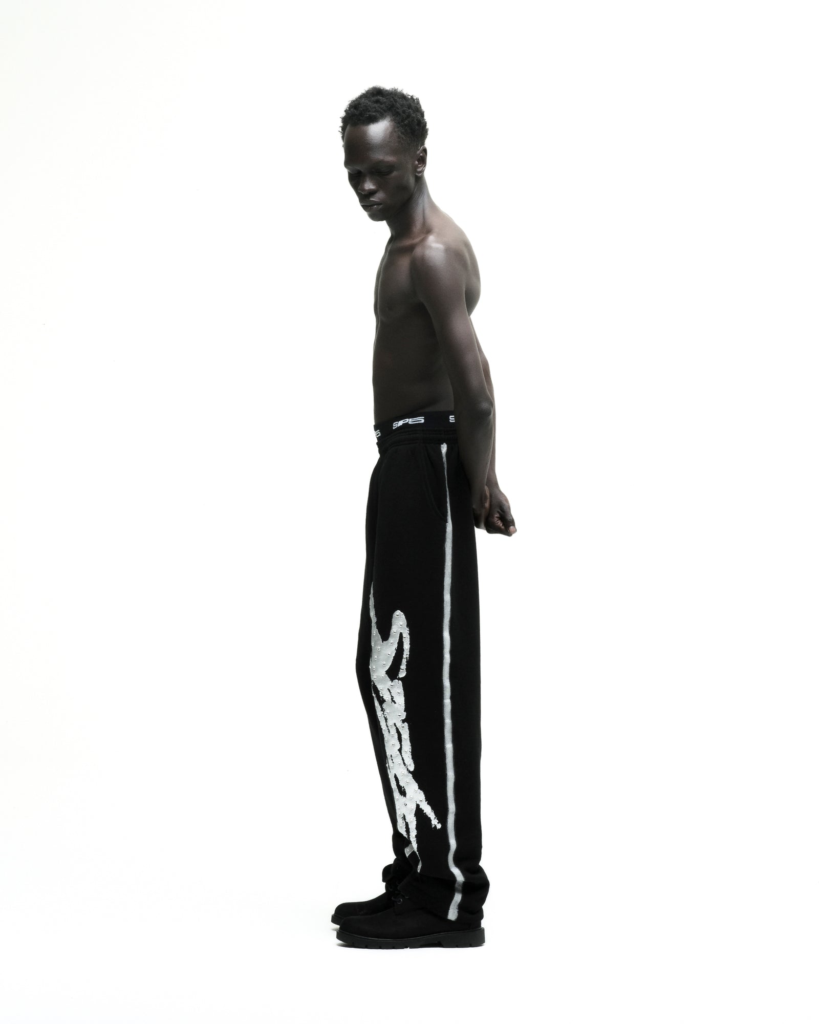 Black cotton fleece SCREAMING EAGLE SWEATPANT with rhinestone SP5DER logo and sprayed side stripe.