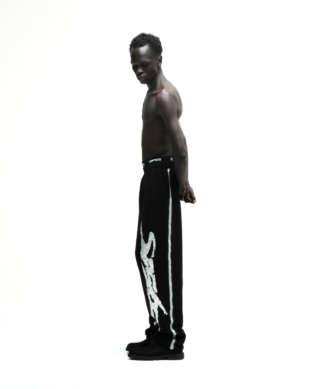 Black cotton fleece SCREAMING EAGLE SWEATPANT with rhinestone SP5DER logo and sprayed side stripe.