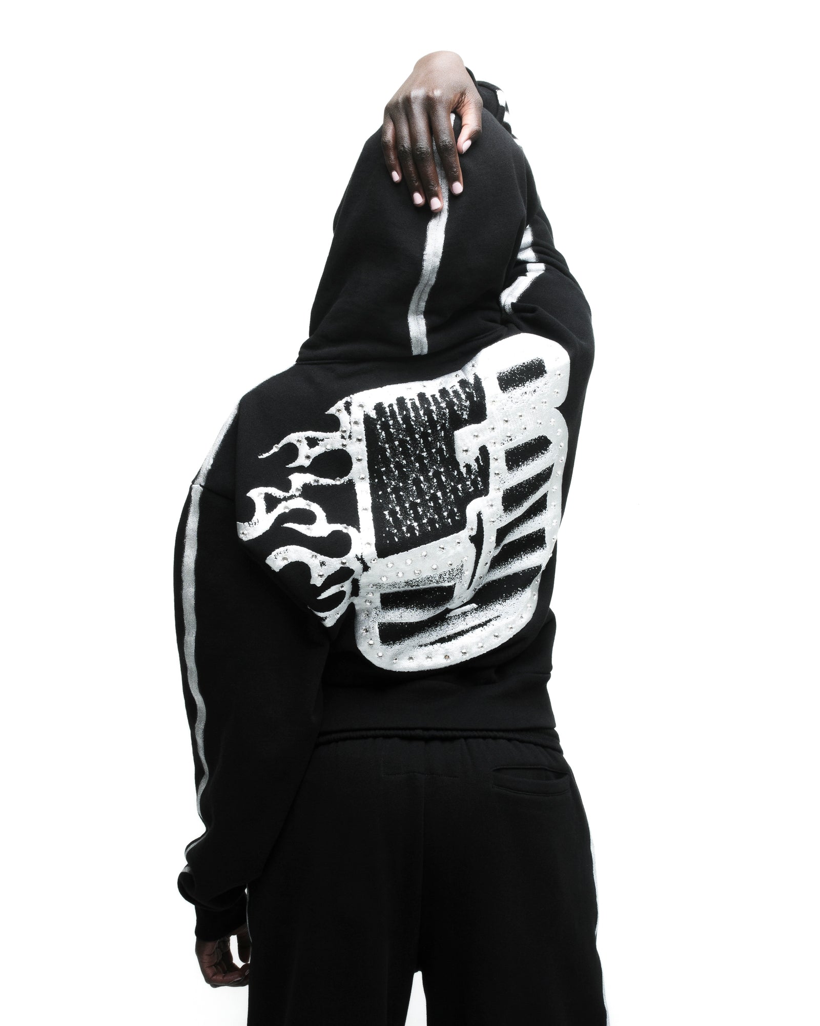 Black cotton fleece hoodie with flaming "5" rhinestone graphic and sprayed stripes.