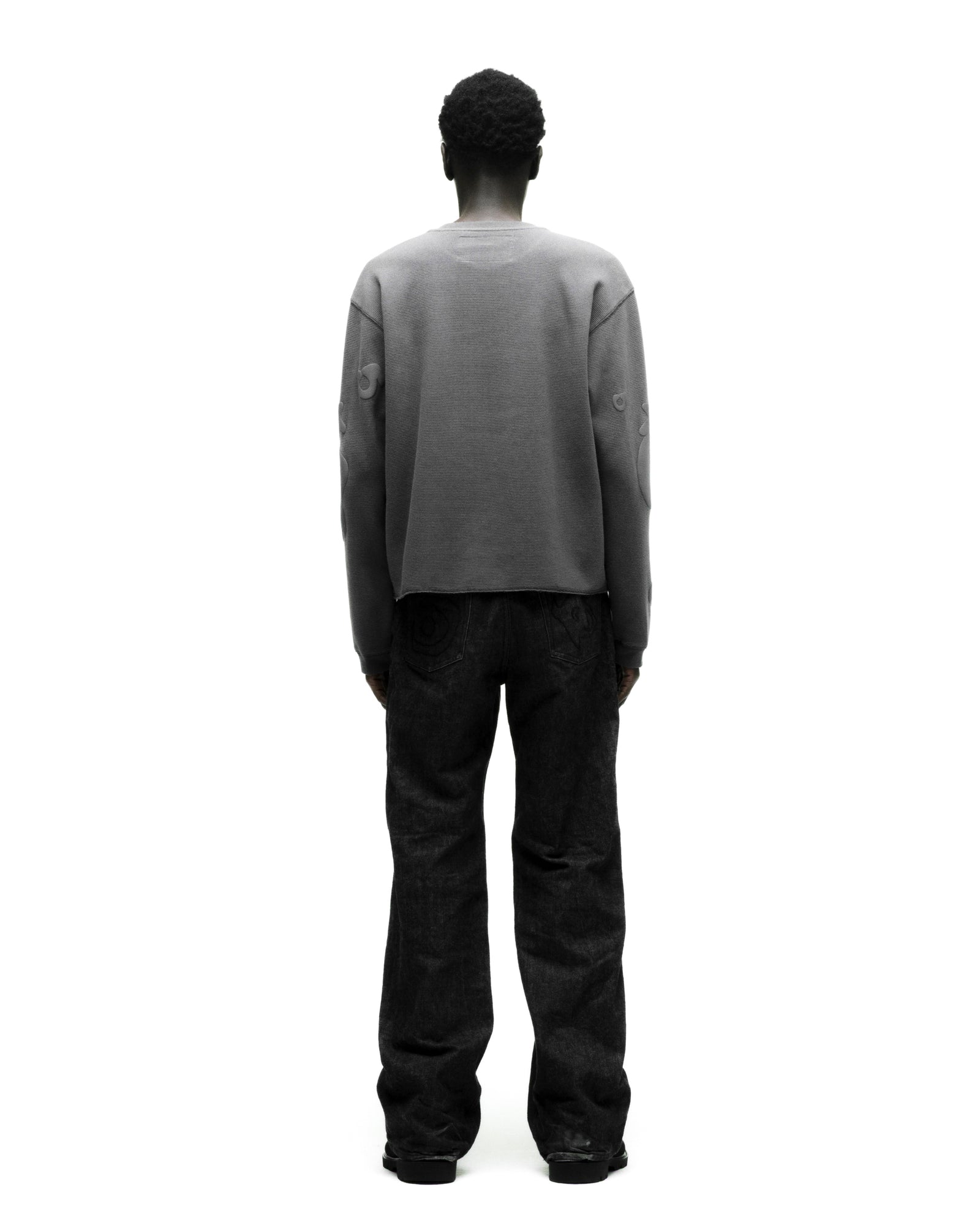 Gray waffle knit thermal with Beluga print, ribbed collar, hem, and cuffs, worn by a person facing away.