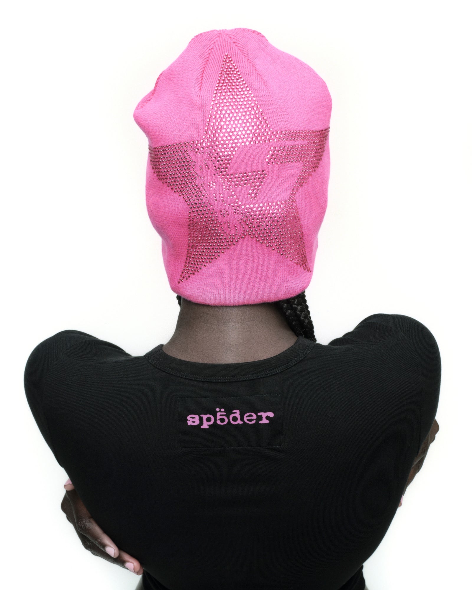 Pink acrylic beanie with a large, sparkly rhinestone star design.