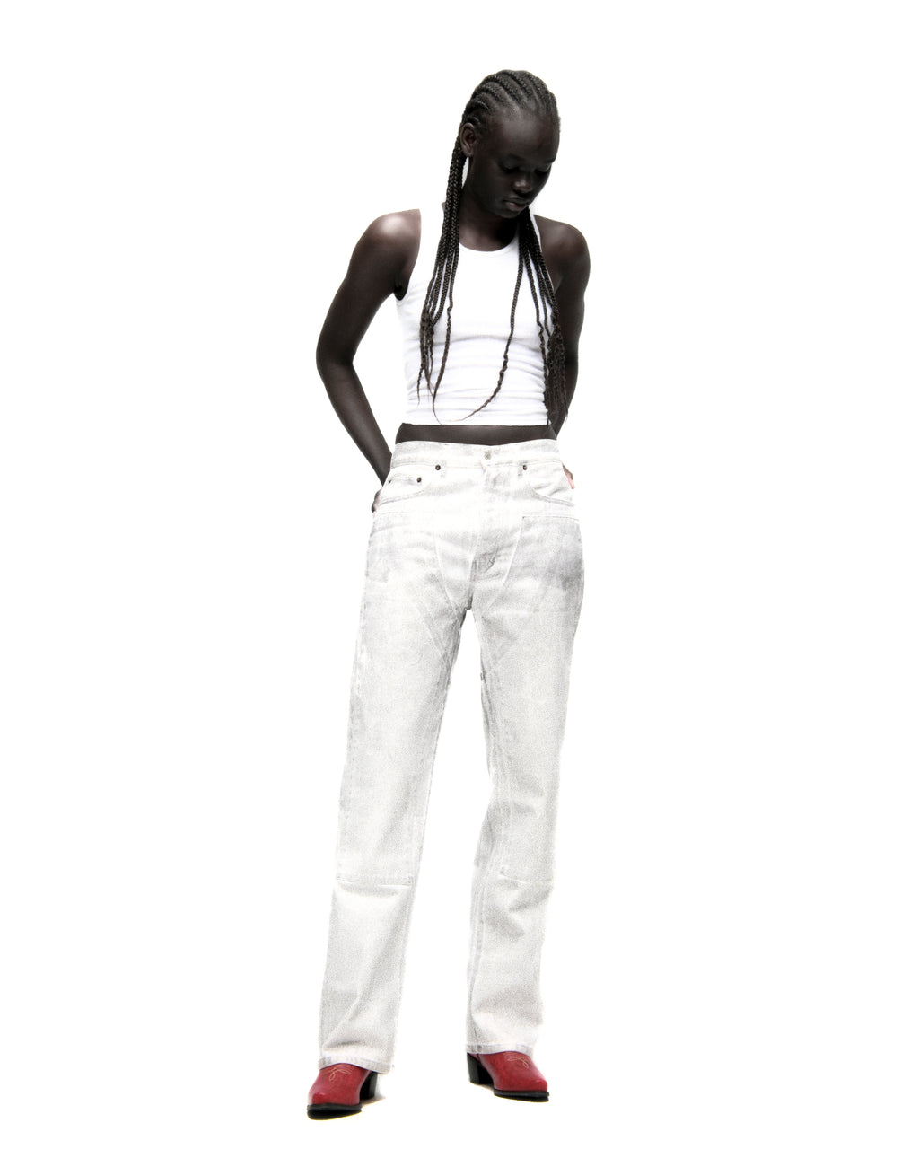 Model wearing wide-leg PLATINUM DENIM PANT with a spray effect, five-pocket styling, and custom hardware.