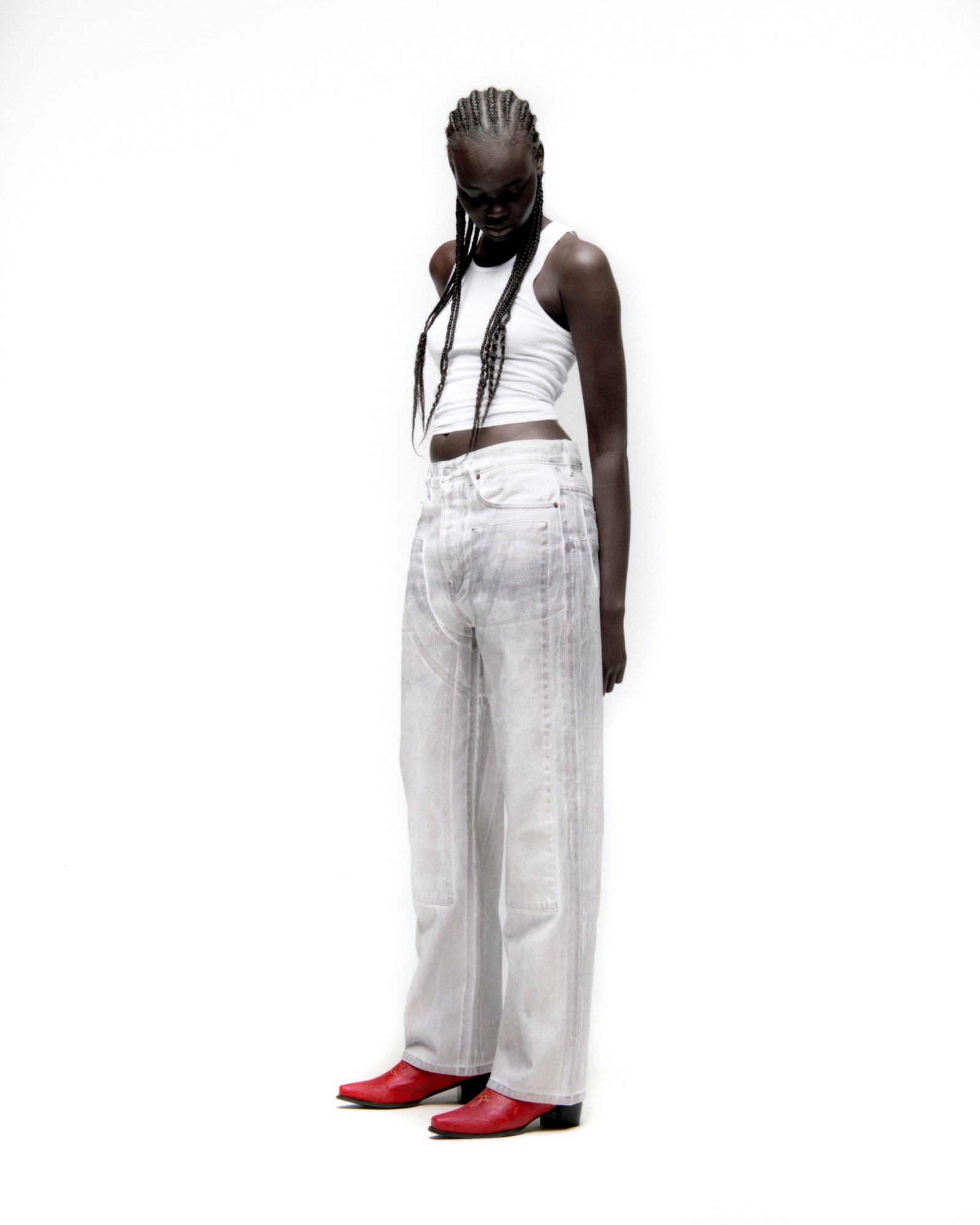 Model wearing PLATINUM DENIM PANT with spray-effect, front panels, and wide leg fit.