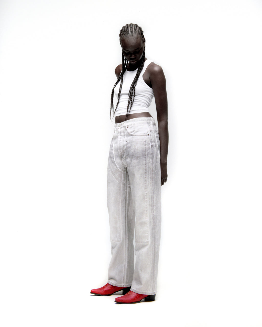 Model wearing PLATINUM DENIM PANT with spray-effect, front panels, and wide leg fit.