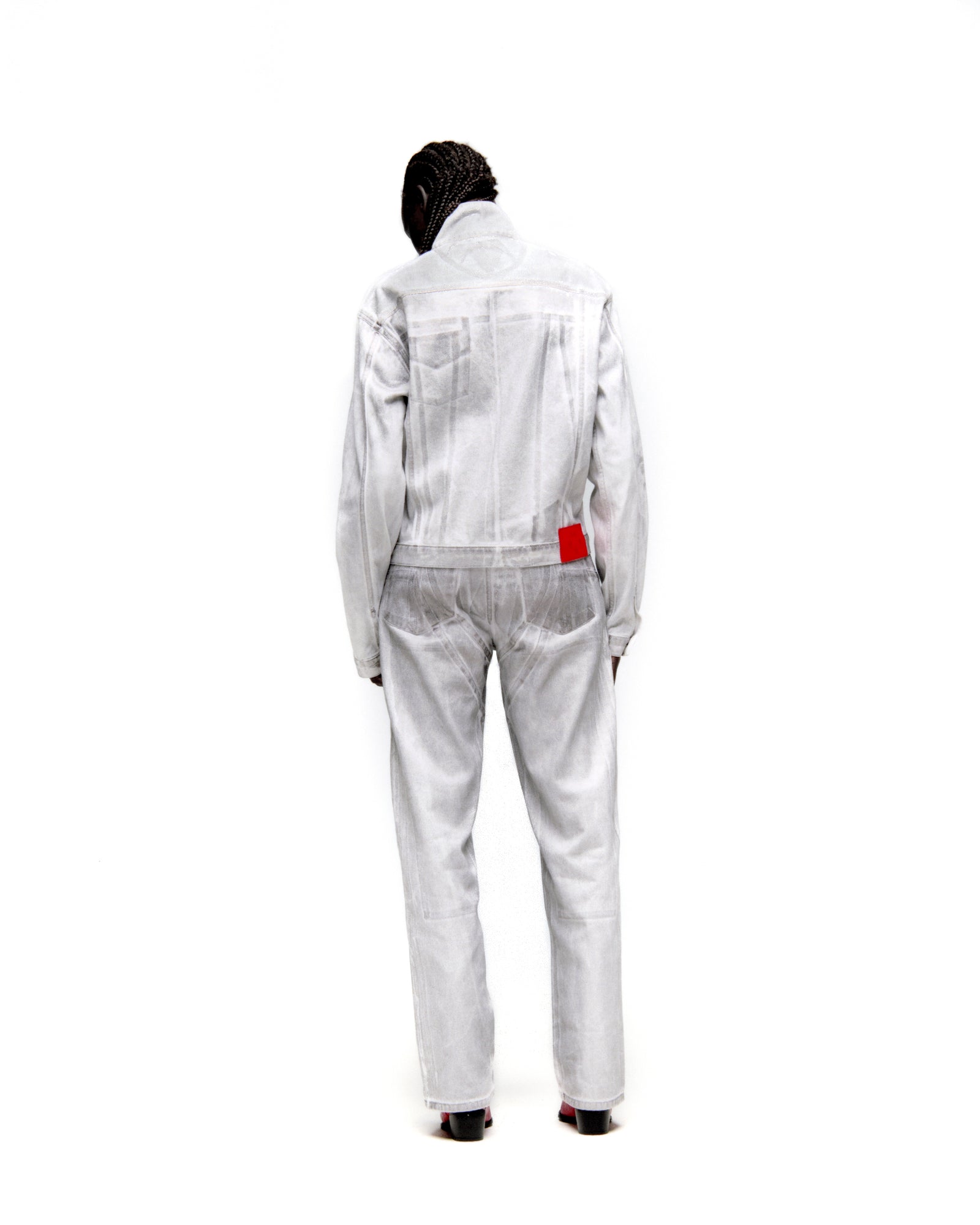 Platinum trucker jacket and matching jeans with spray-effect denim and contrast seams, viewed from the back.