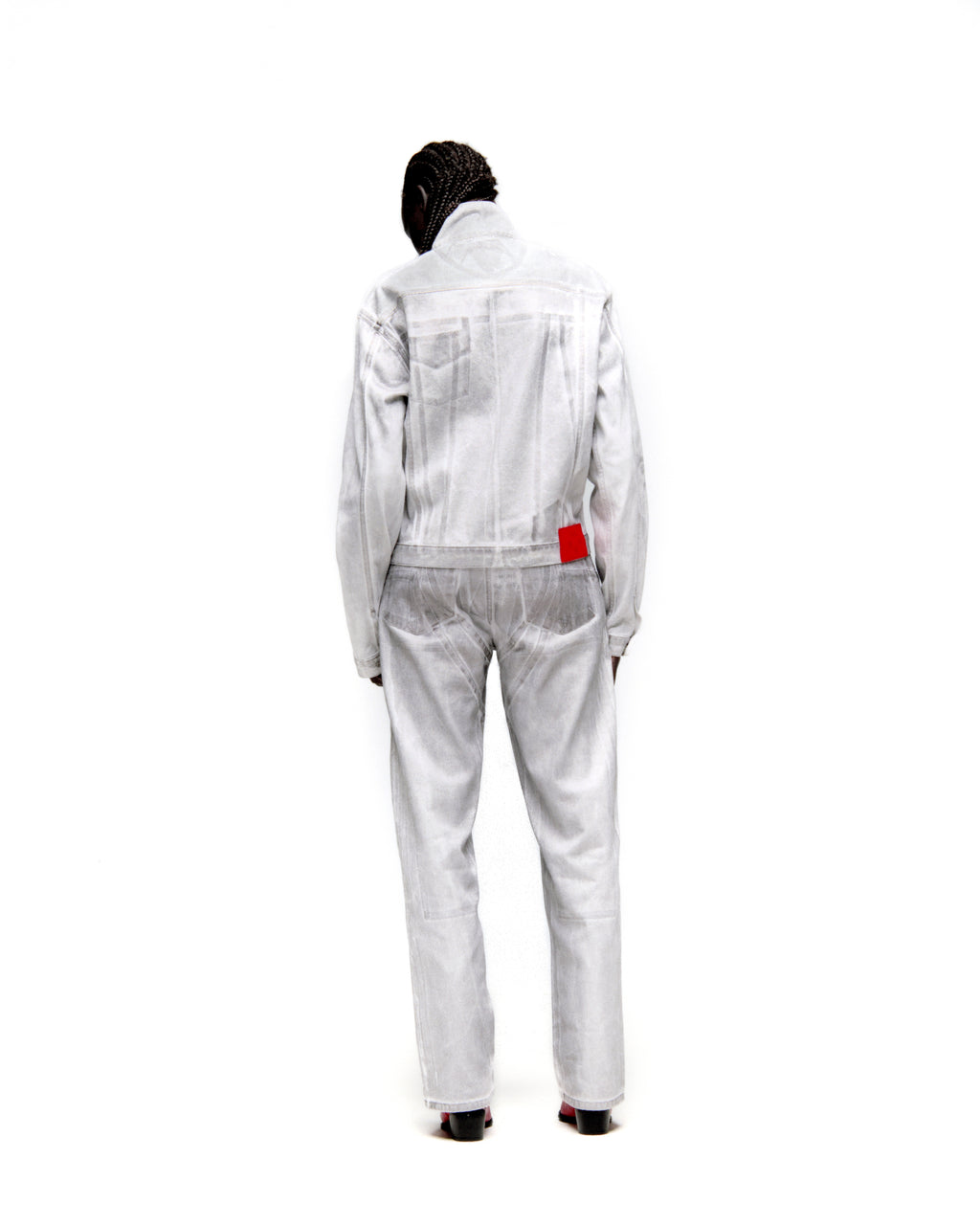 Platinum trucker jacket and matching jeans with spray-effect denim and contrast seams, viewed from the back.