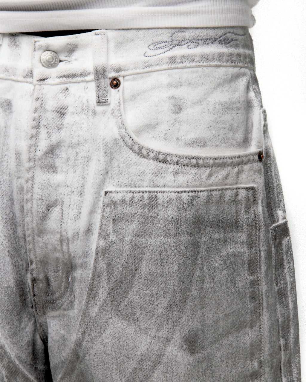 Platinum denim pant with spray-effect wash, custom hardware, and front panels.