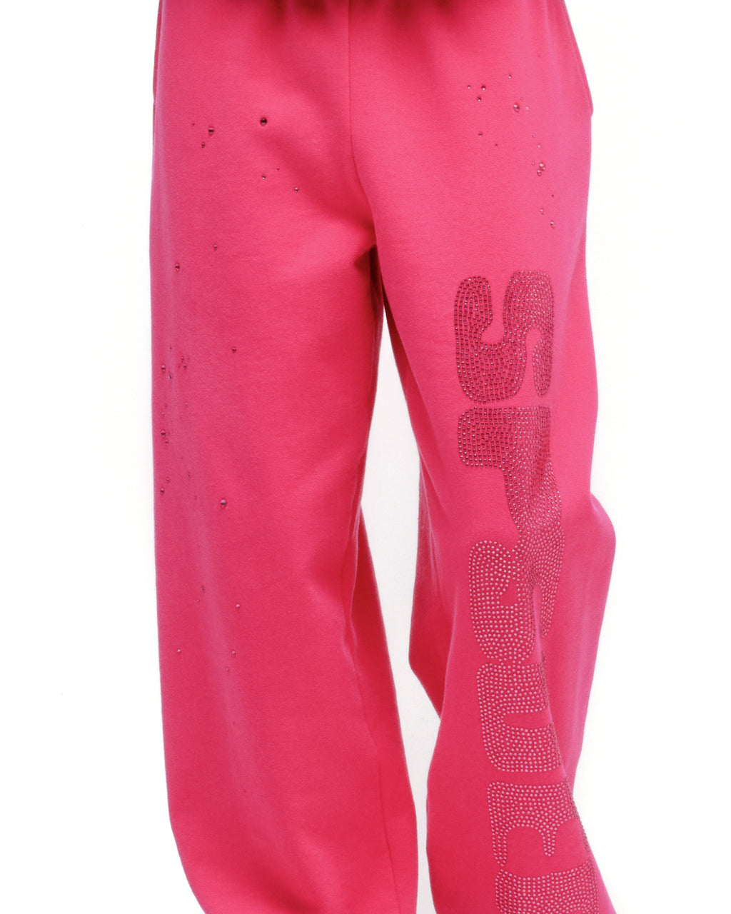 Pink cotton fleece sweatpants with rhinestone embellishment on the leg, elasticized waistband and cuffs.