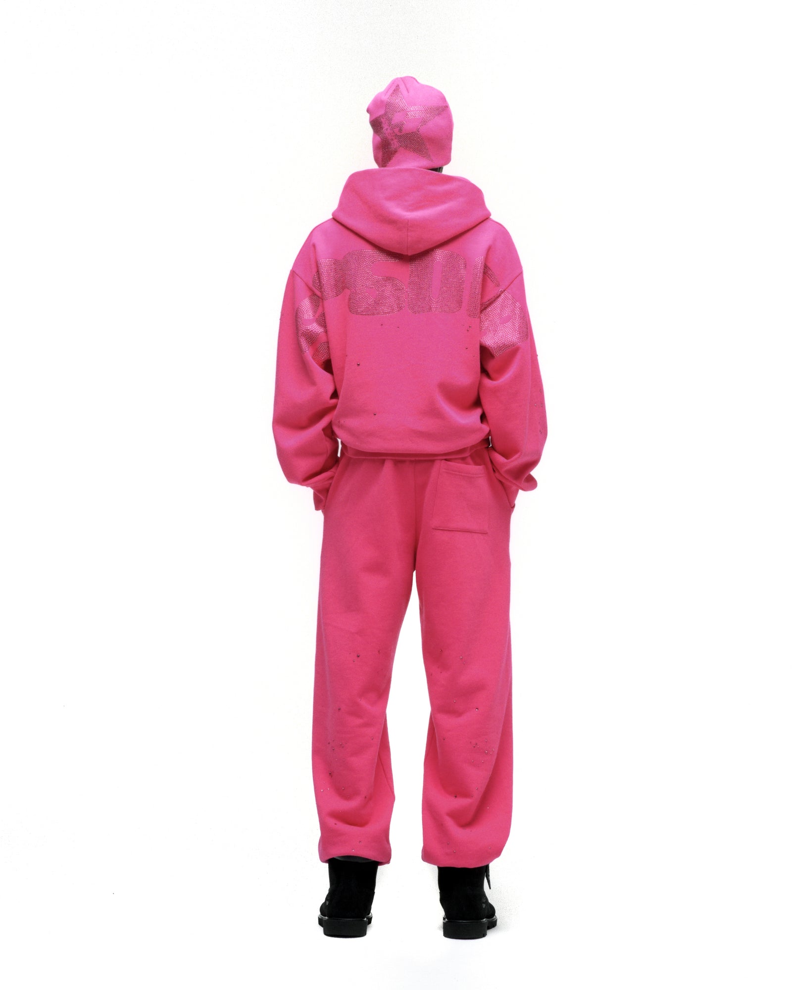 Pink rhinestone silk hoodie and sweatpants set with "RHINESTONE" design on back.