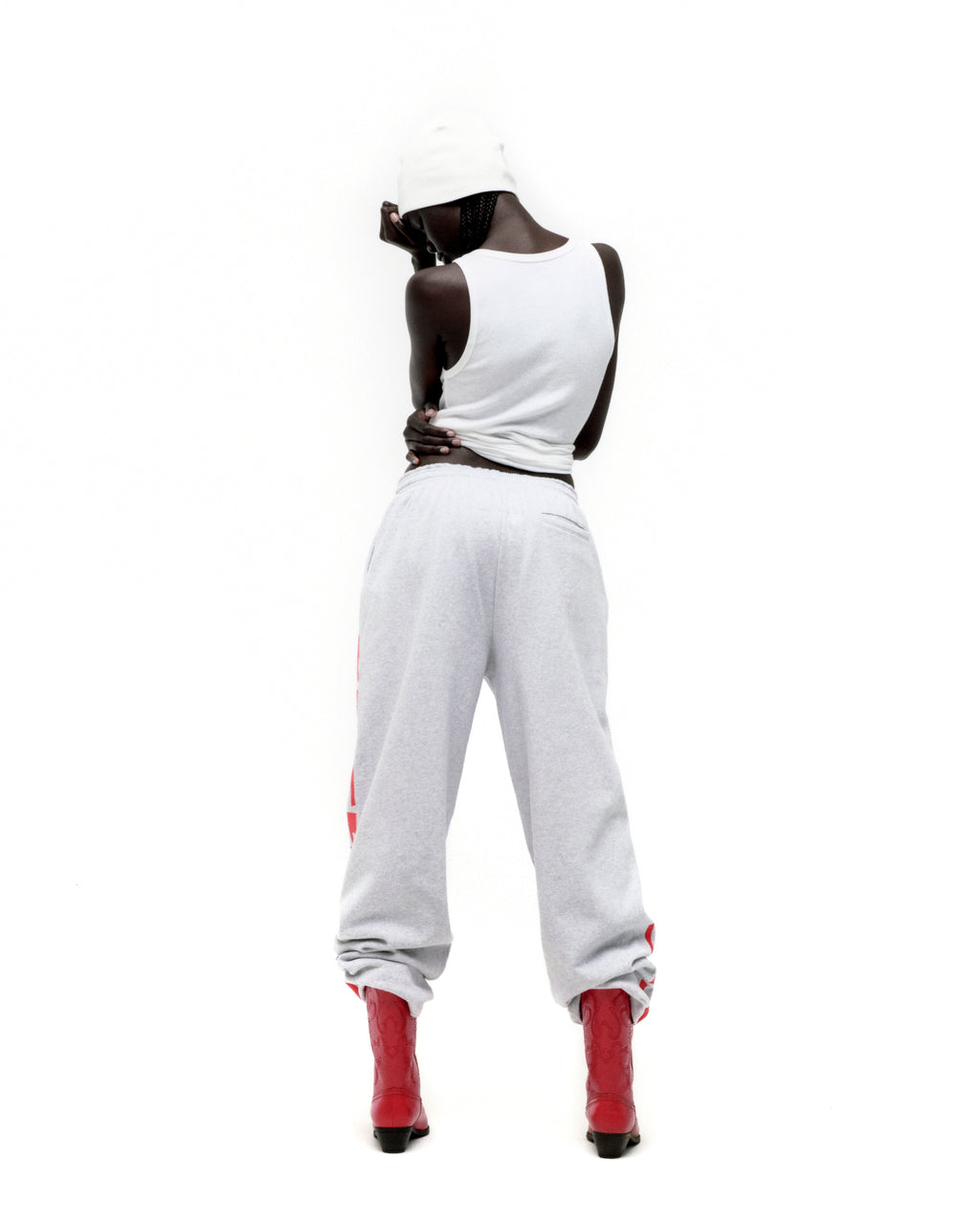Light grey MX555 sweatpants, 100% cotton fleece, with red foil SP5DER print, wide-leg.
