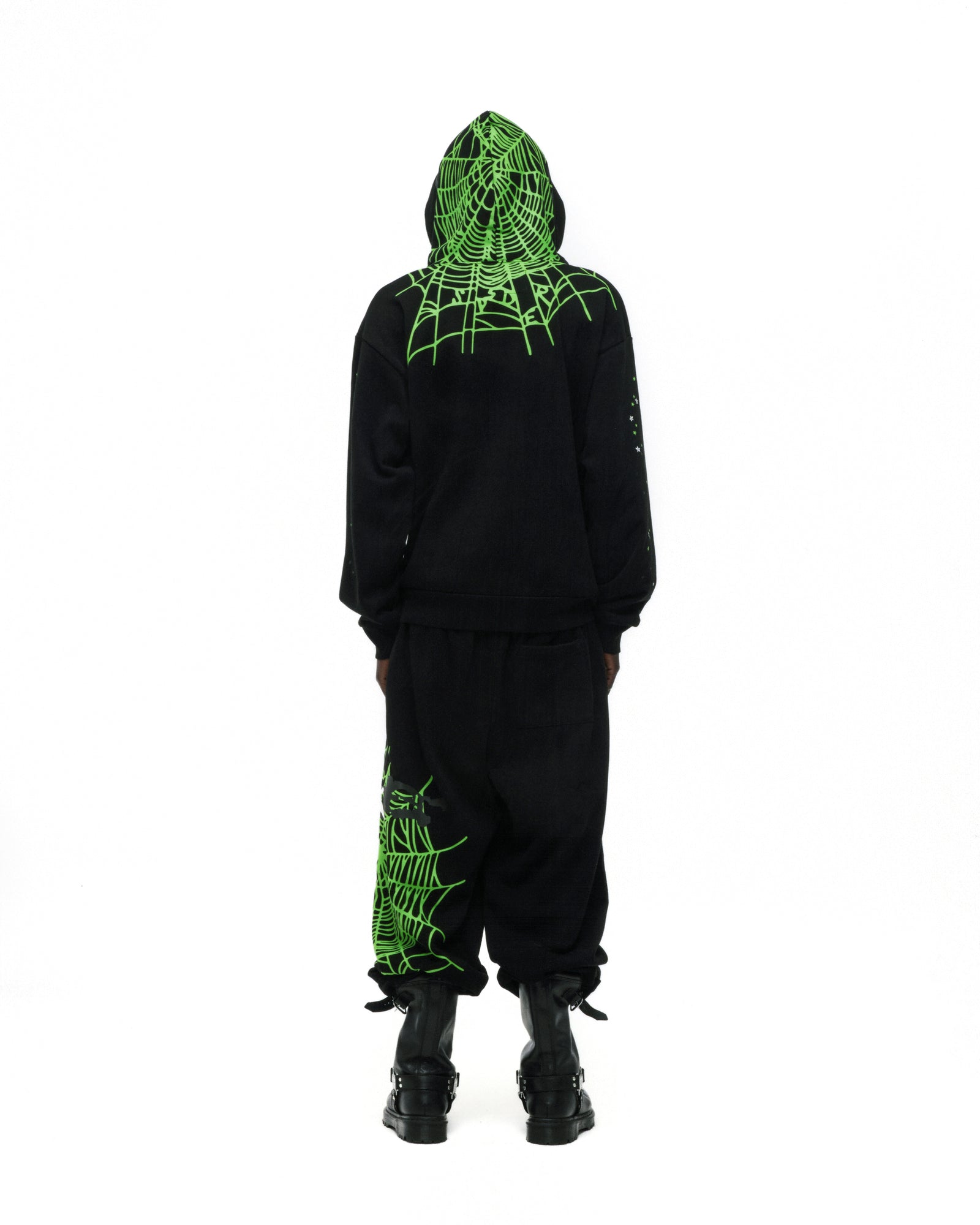 Black cotton fleece hoodie with neon green web print on hood and shoulders, matching sweatpants.