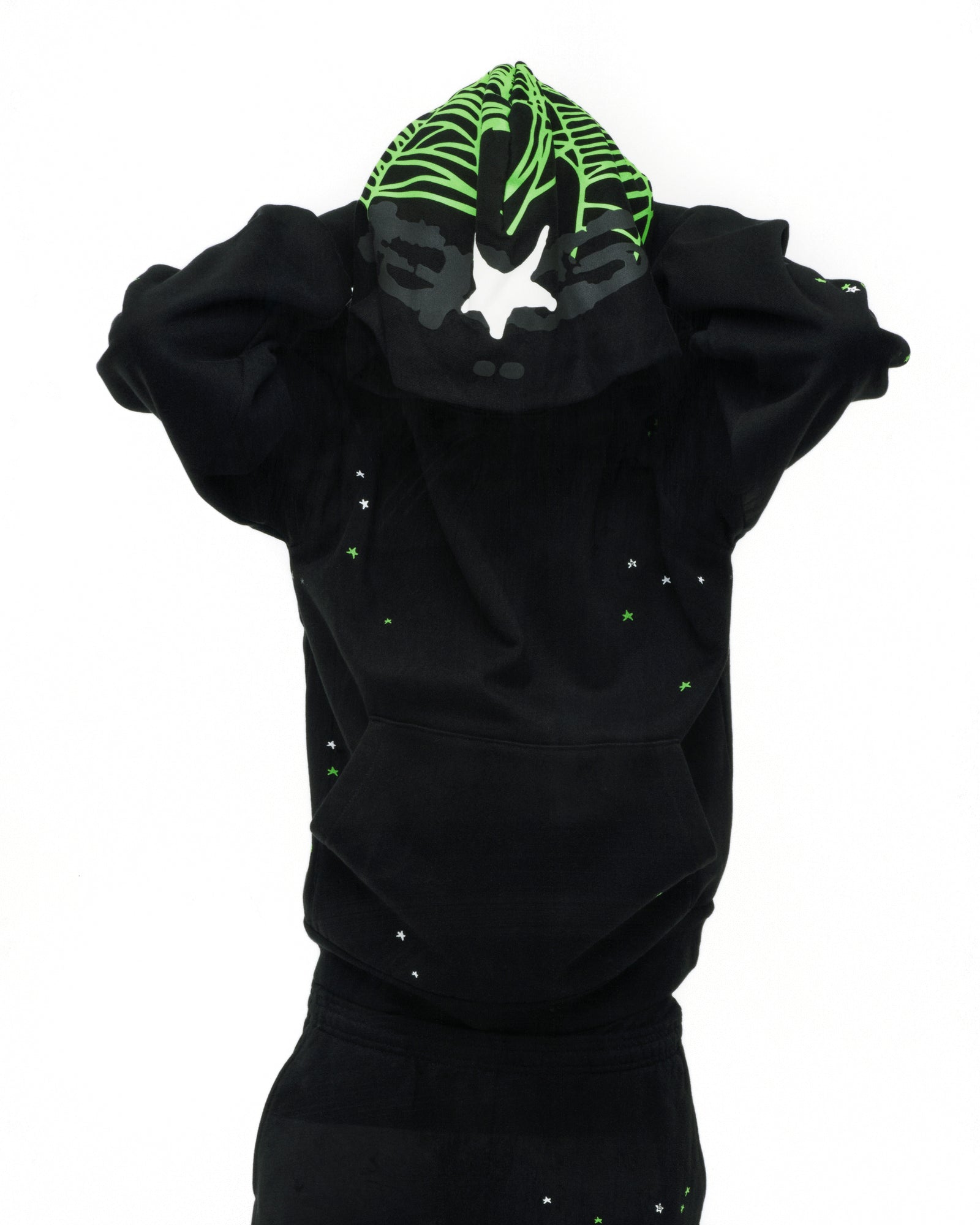 Black 13oz cotton fleece hoodie with green web print hood, scattered stars, and kangaroo pocket.