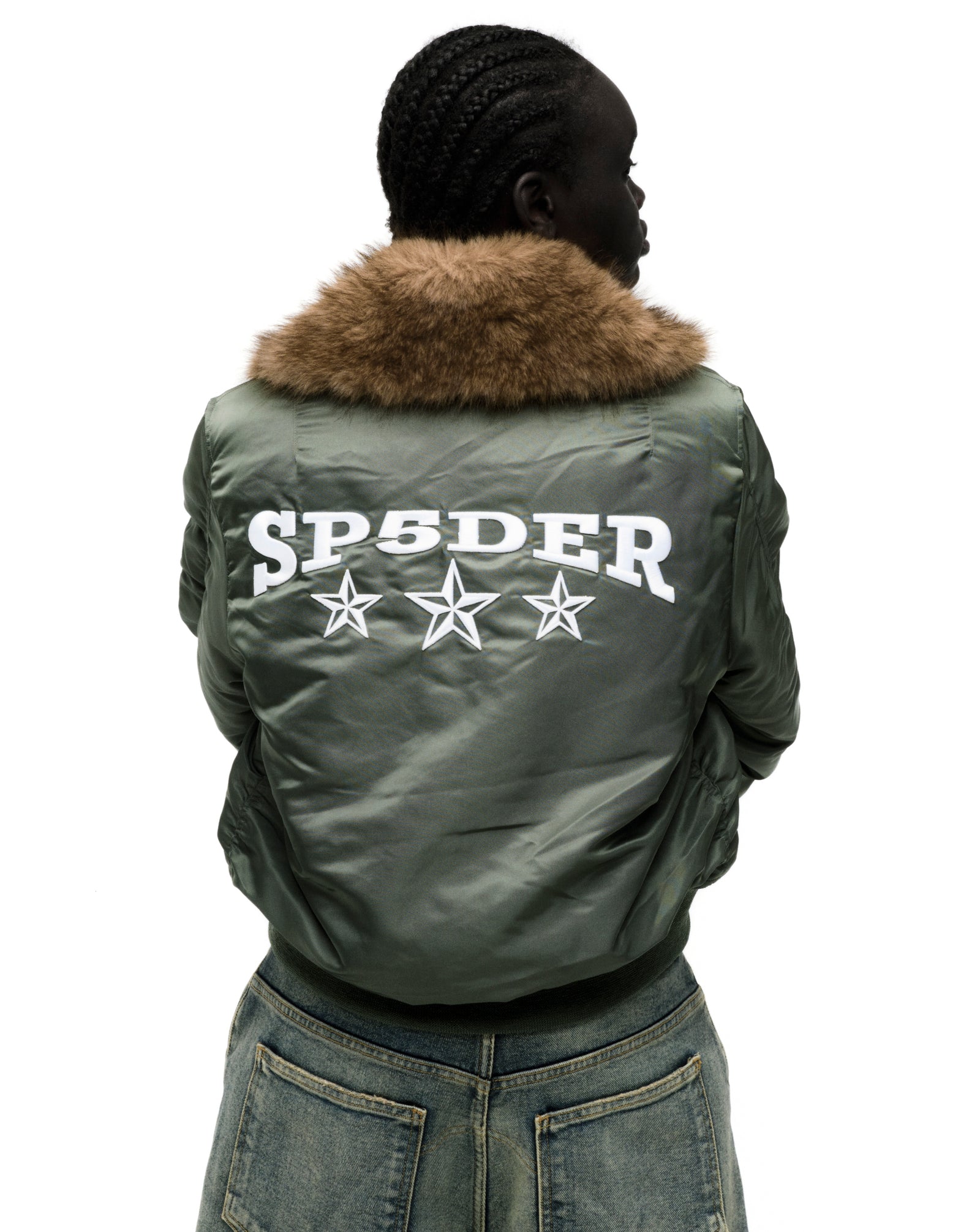 Olive green nylon bomber jacket with faux fur collar and white SP5DER graphic with stars on the back.