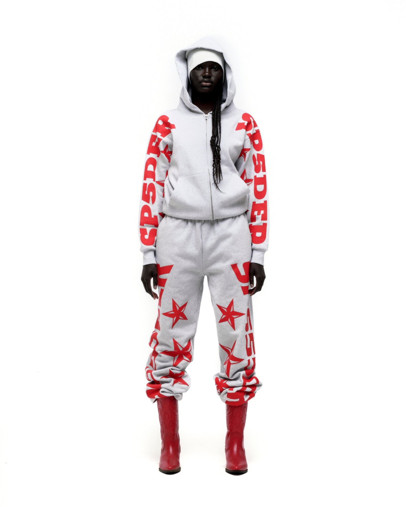 Light grey cotton fleece MX555 ZIP HOODIE and sweatpants with red SP5DER text and star prints.