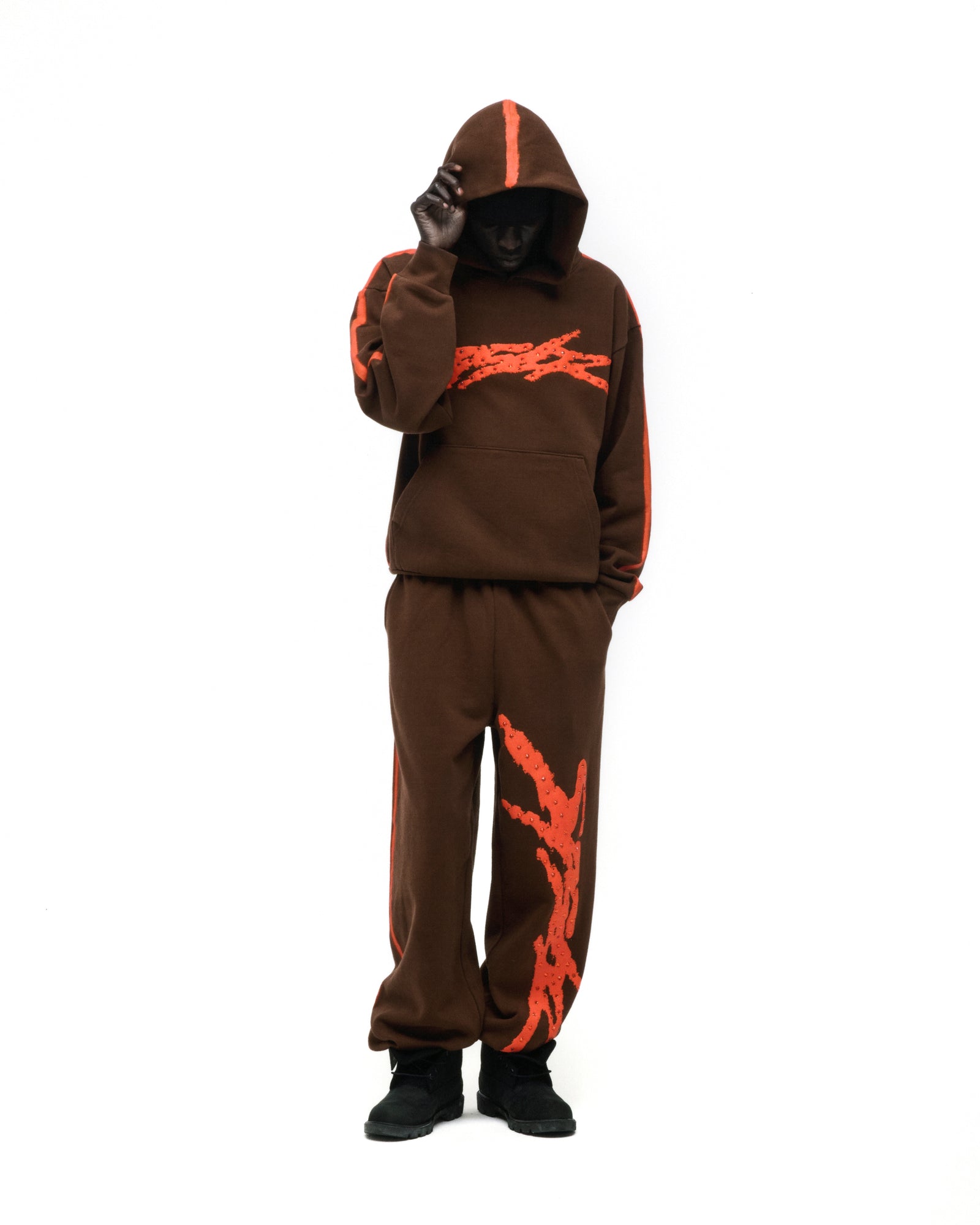 Brown fleece hoodie and sweatpants with orange sprayed-effect stripes and flaming "5" design.