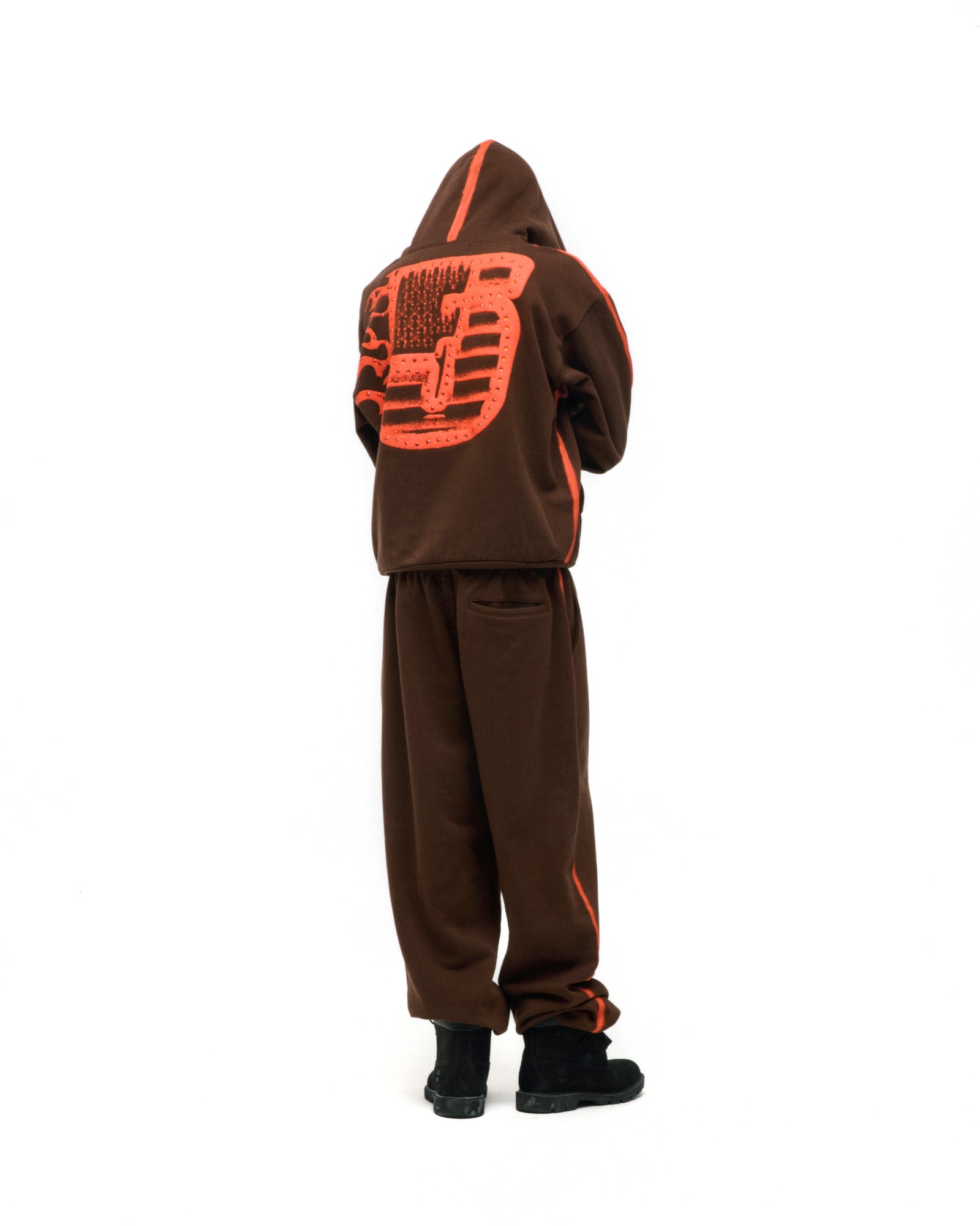 Brown fleece hoodie and sweatpants with orange sprayed stripes, flaming "5" graphic on back.