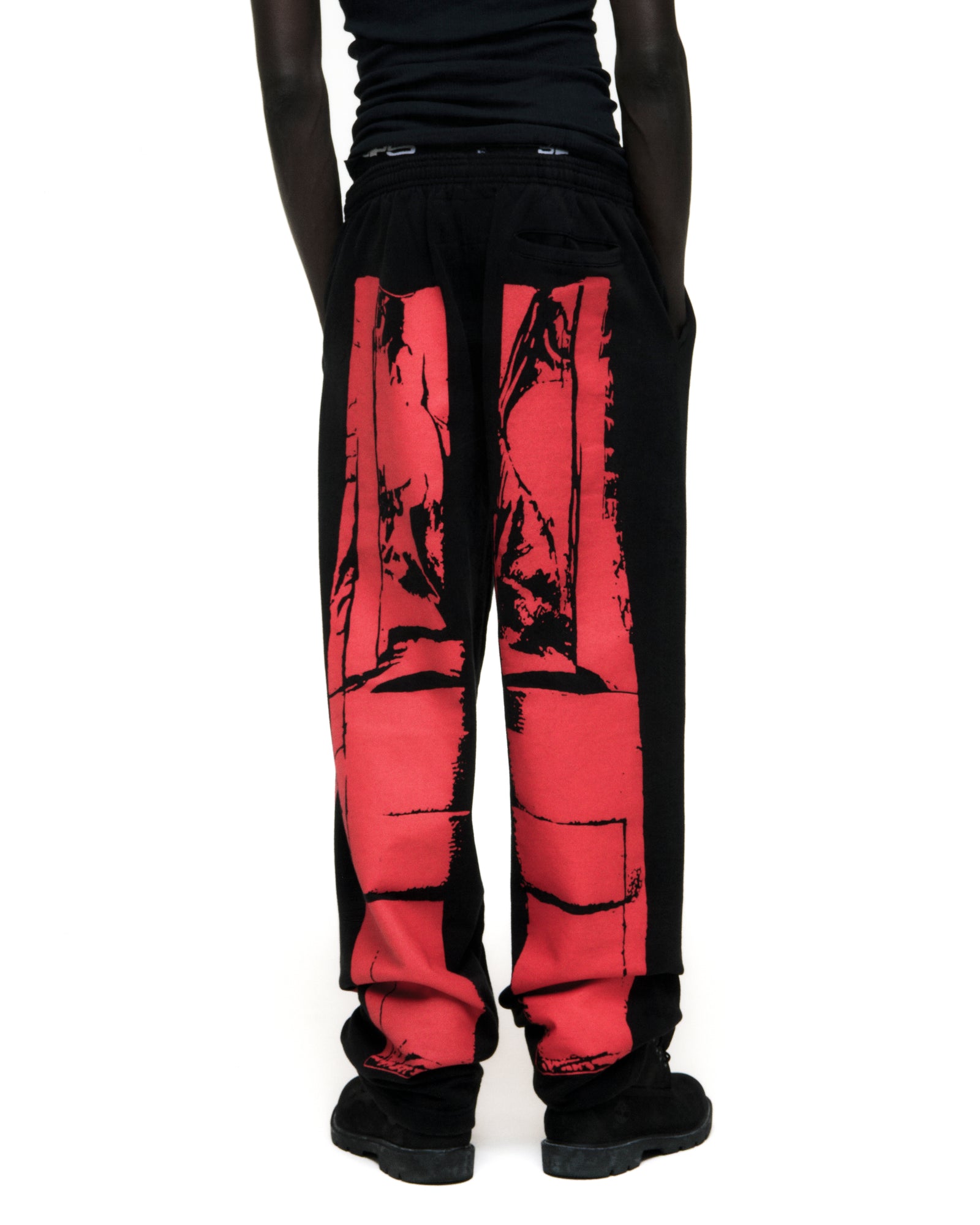 Black JP5 MOTO SWEATPANT with red painted moto design, wide-leg, and elasticized waistband.