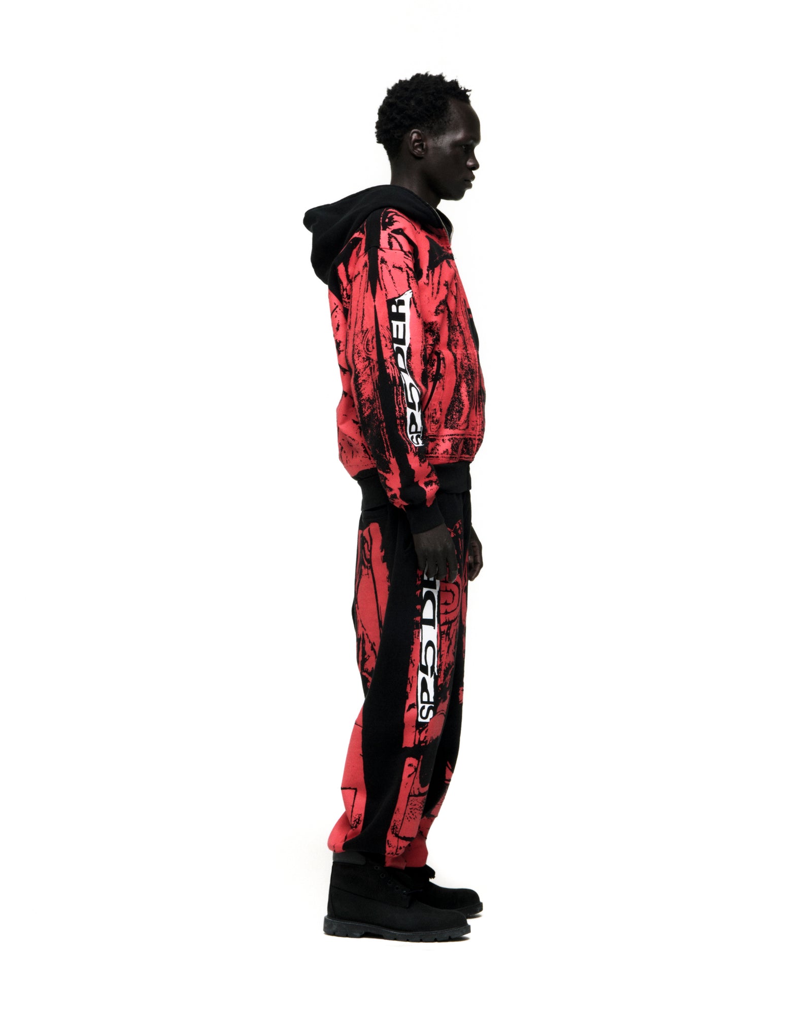 JP5 MOTO HOODIE: Black man in red and black painted moto fleece hoodie and matching pants.