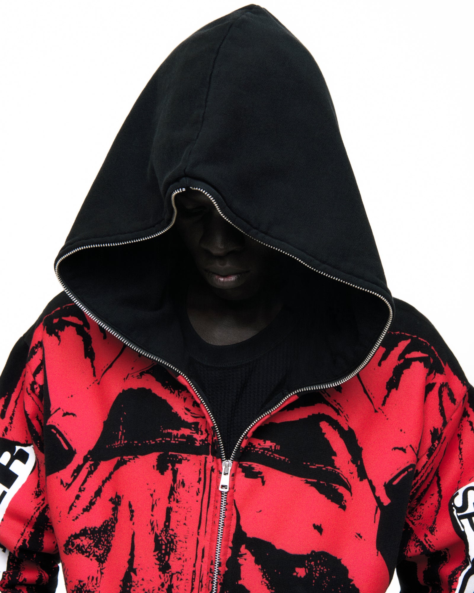 Black cotton fleece hoodie with red painted moto design, full zipper, and ribbed cuffs.