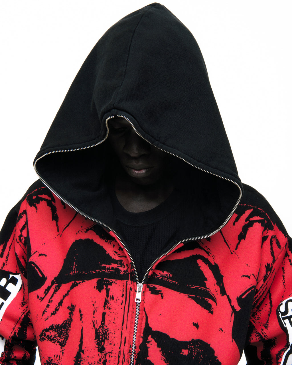Black cotton fleece hoodie with red painted moto design, full zipper, and ribbed cuffs.