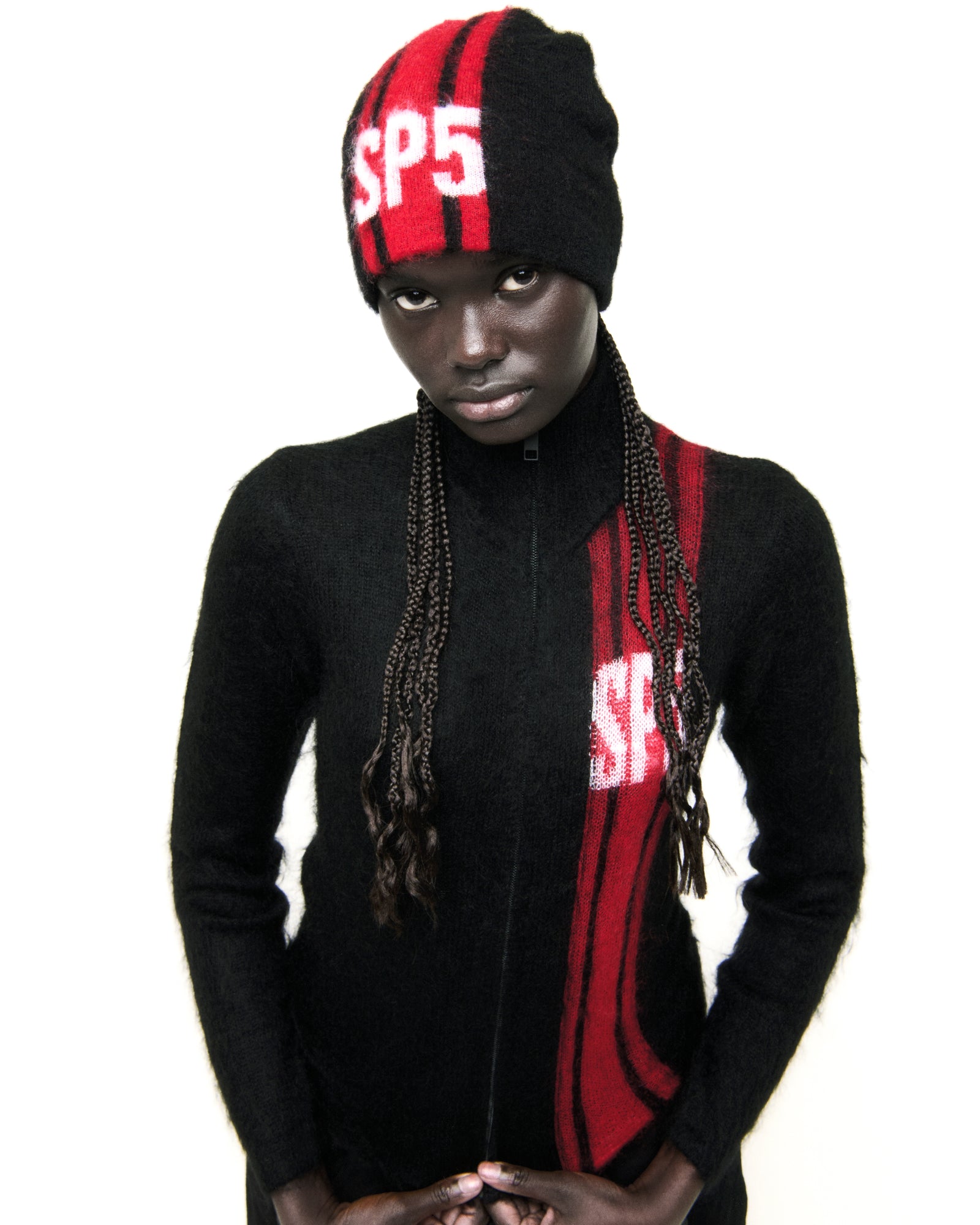 Black mohair knit RALLY BEANIE with red vertical stripes and a white "SP5" logo.