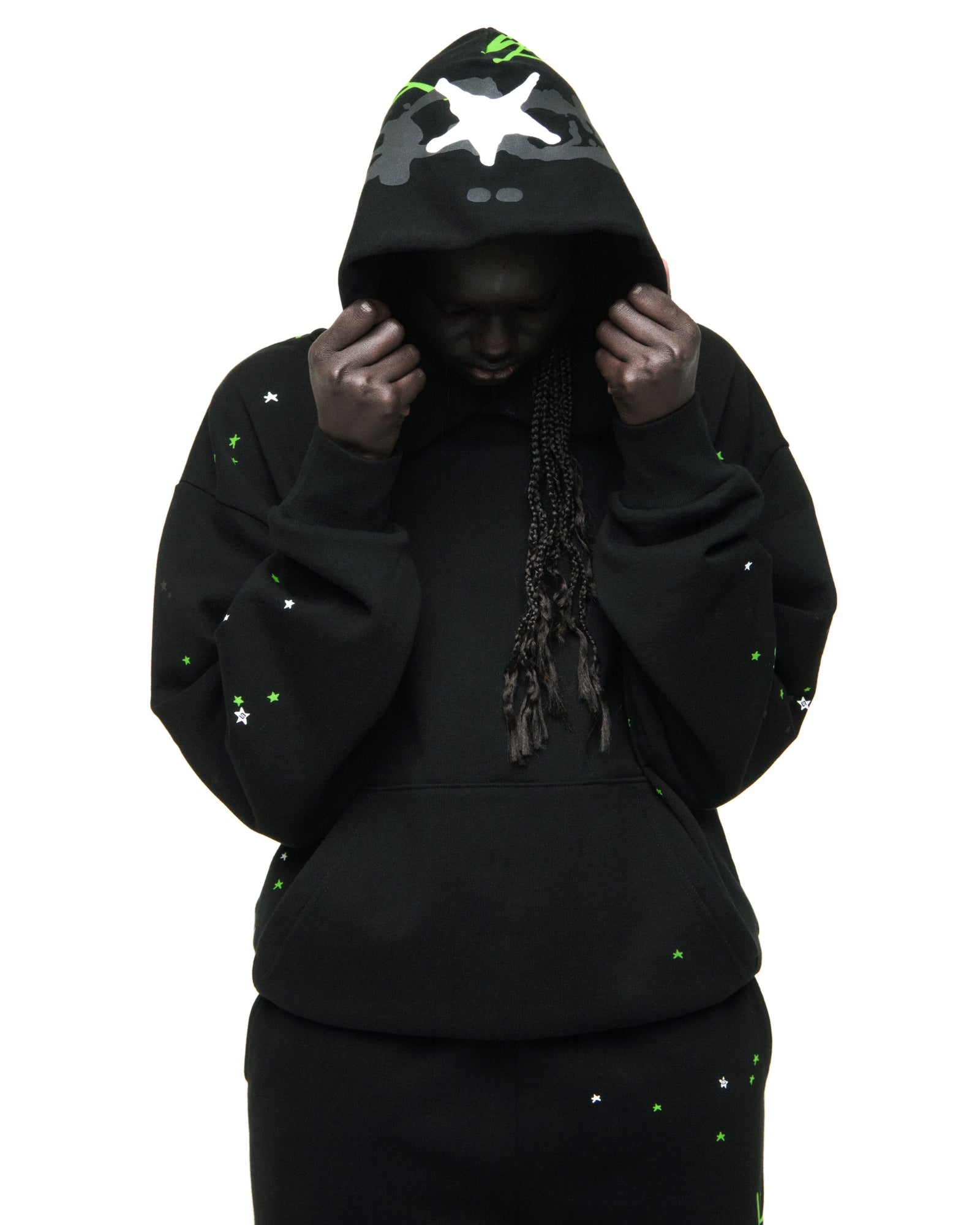 Black heavy web hoodie with scattered green and white stars, puff print, and kangaroo pocket.